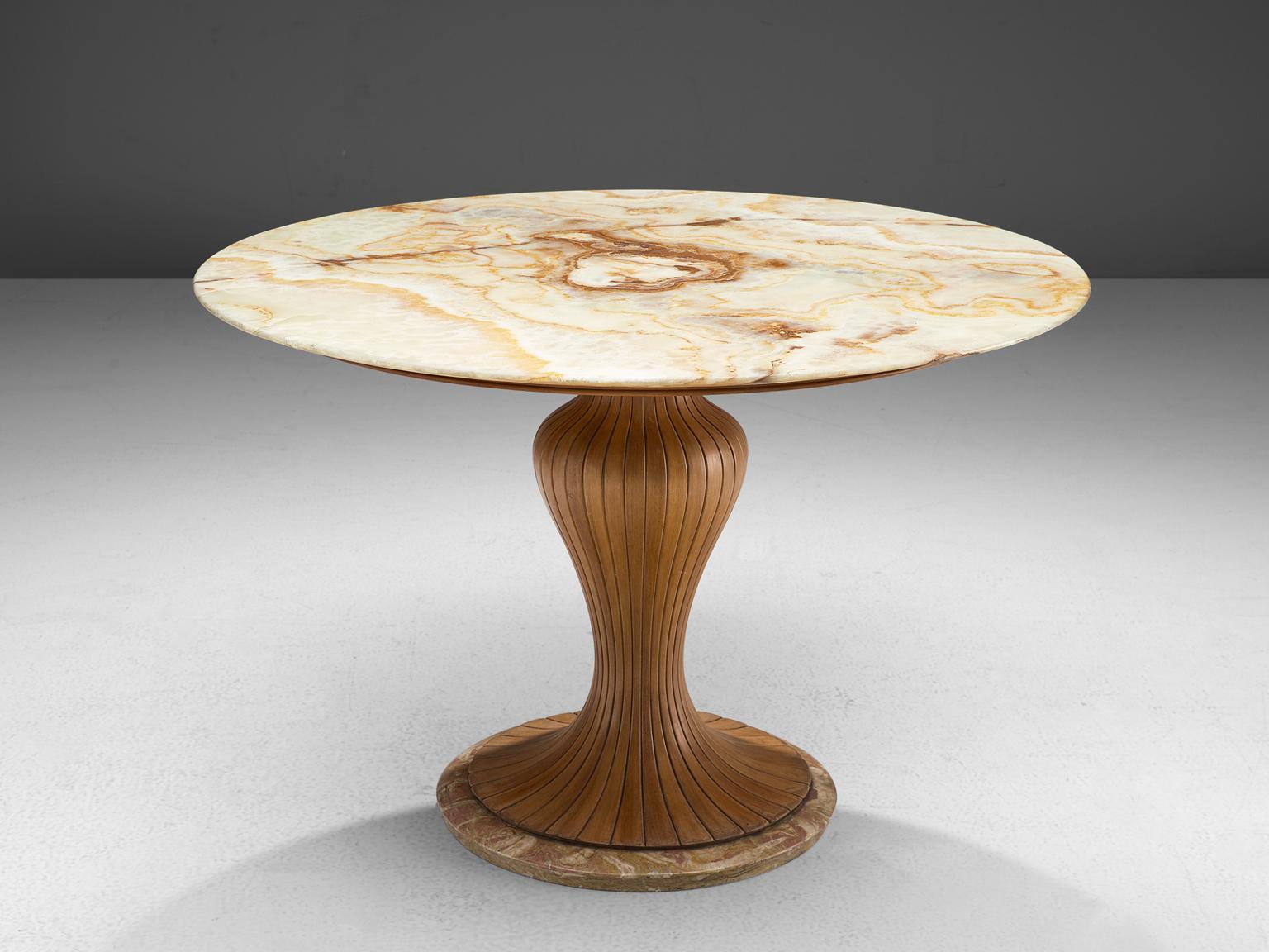 Osvaldo Borsani for Arredamento Borsani, pedestal table, marble and mahogany, Italy, 1950s.

This distinctive center table is made in the 1950s and holds a classic, wooden decorated shaft. The main feature of this table is the beautiful sand colored