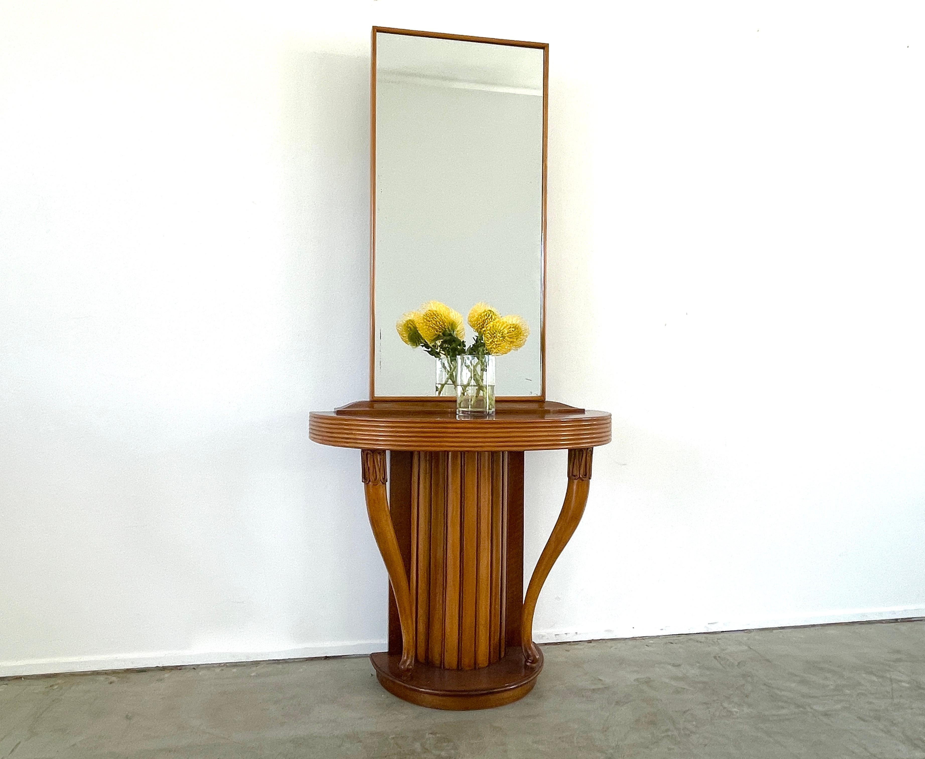 Osvaldo Borsani curved console with attached mirror circa 1940s
Beautiful curved shape with slatted maple and mahogany wood 
Great original patina.
 