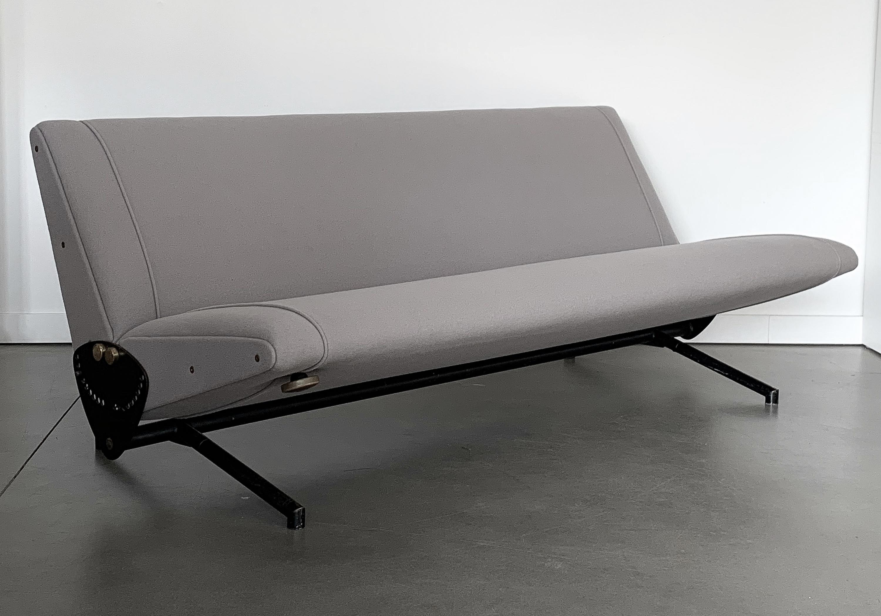 Iconic D70 fully adjustable sofa designed by Osvaldo Borsani for Tecno, circa 1950s. Convertible into a daybed when folded flat. Newly upholstered in a light gray wool fabric by Maharam / Kvadrat with new foam throughout. The base is black enameled
