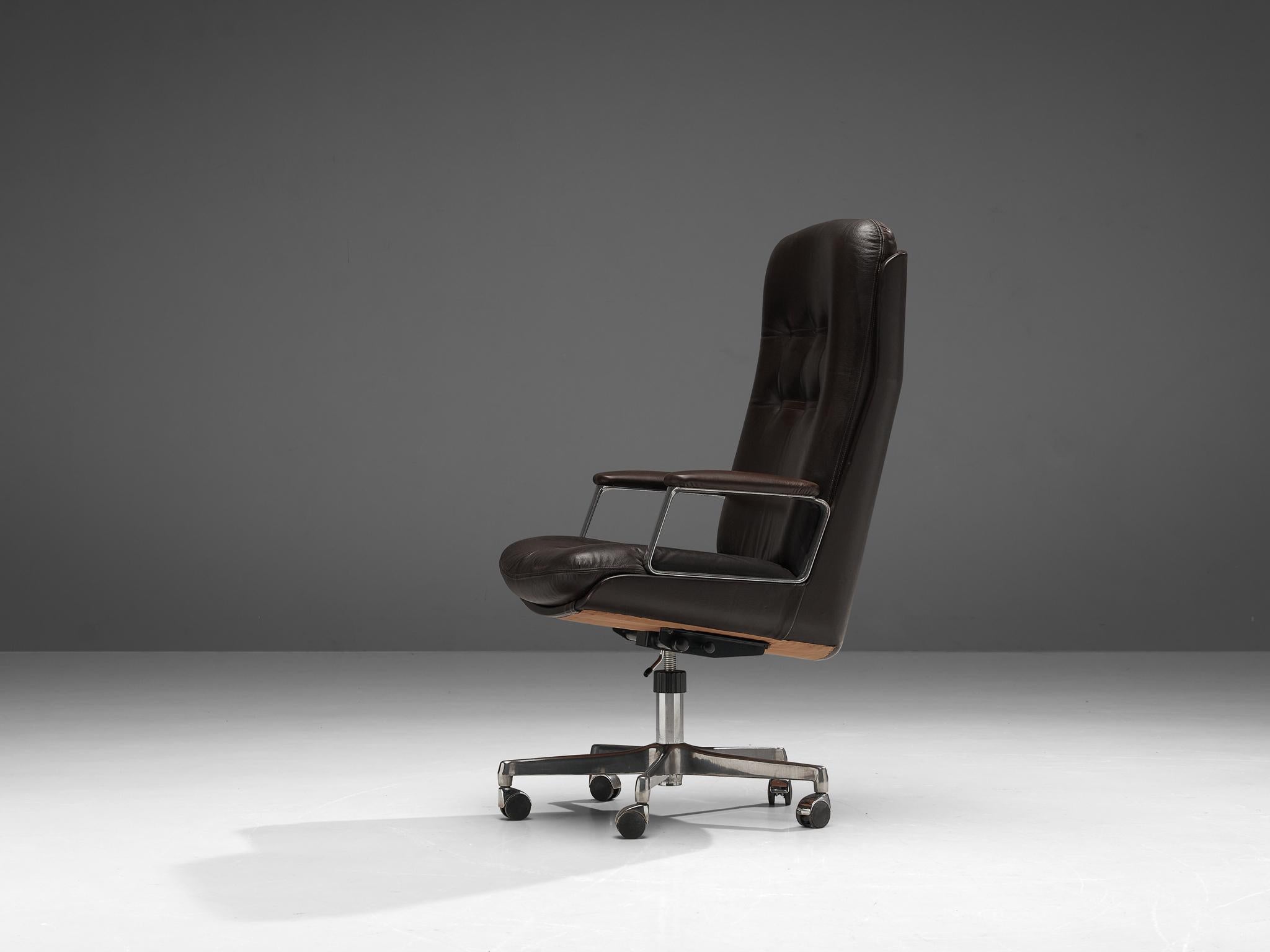 Osvaldo Borsani for Tecno, desk chair, leather, metal, Italy, 1960s

Osvaldo Borsani designed this swivel armchair as an office chair in the 1960s. The chair features a high, comfortable backrest with tufted details. The dark brown leather is also
