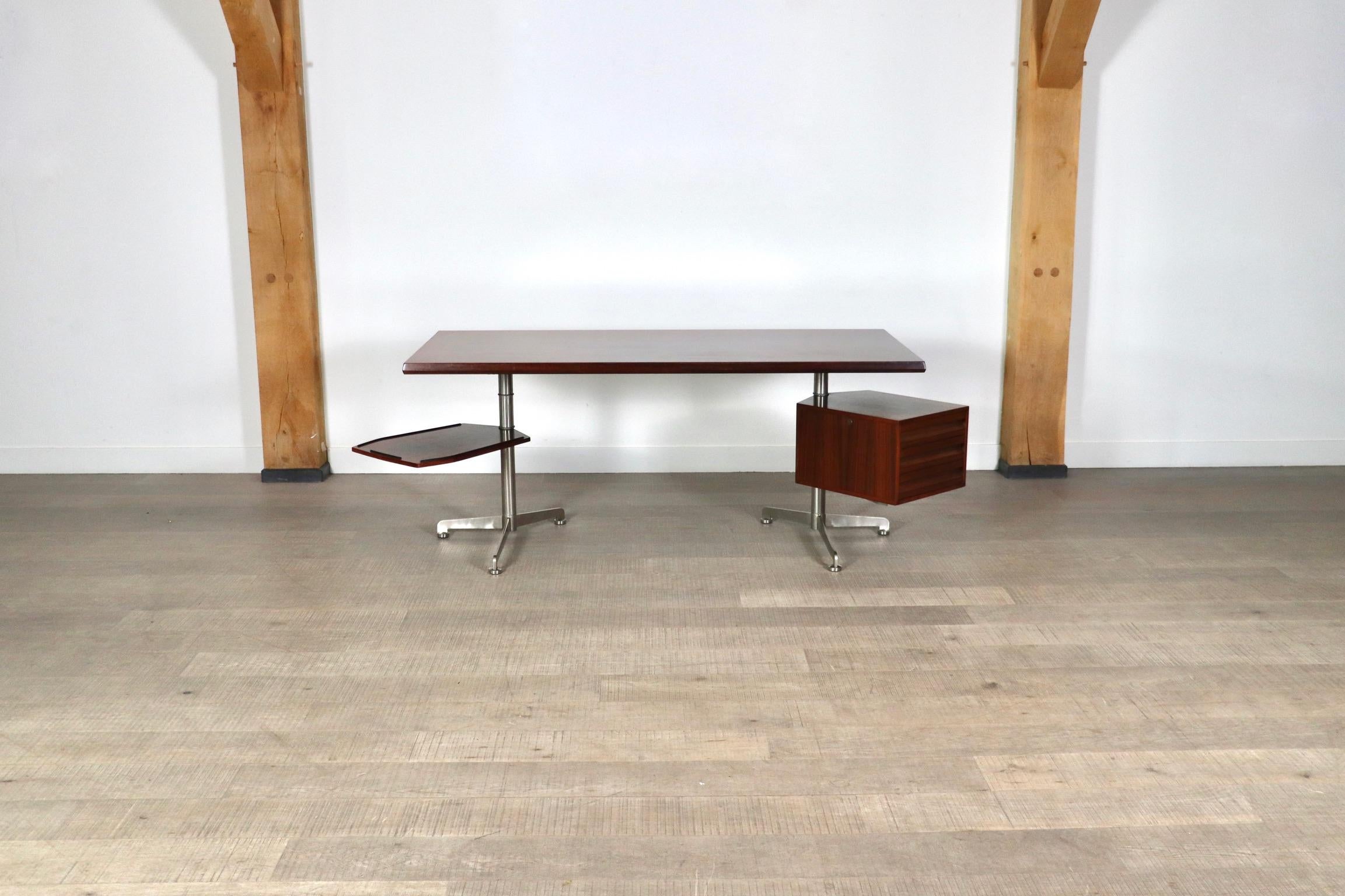 Fantastic office desk model T95 designed by Osvaldo Borsani and manufactured by Tecno, Italy 1960s. The desk has metal legs and rosewood veneer top and compartments. This nice sized desk has a cabinet and an extendable shelve which can turn around