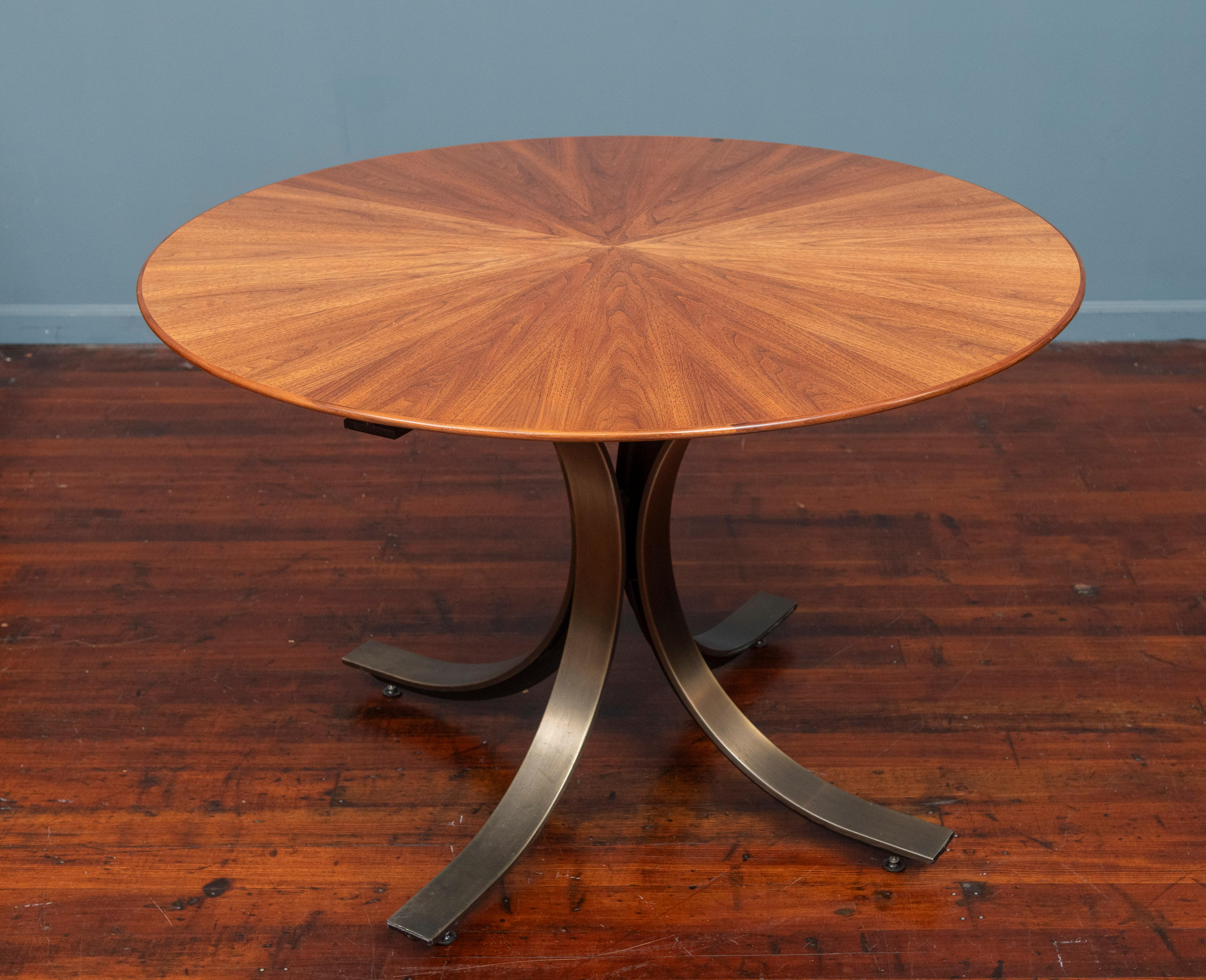 Osvaldo Borsani design small dining table or center table by Stow Davis U.S.A. Beautiful walnut starburst top on a patinated bronze wrapped steel splayed leg base. Sophisticated looking table with a newly refinished top on a solid heavy base, ready