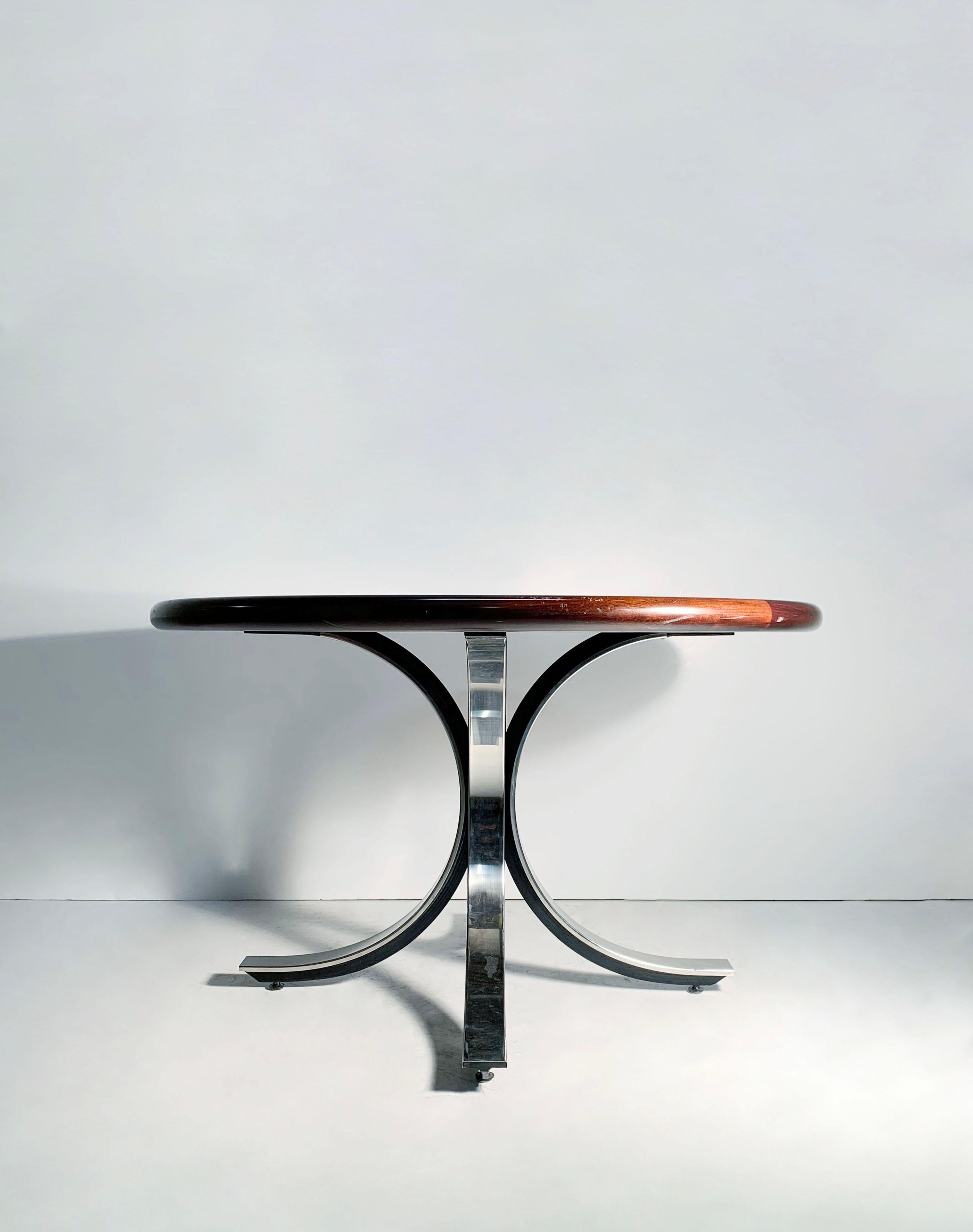 Beautiful high end table produced in the 1970s/1980s attributed to Osvaldo Borsani. The top is easily interchangeable with another top in the event a marble top is desirable. This original top is quite beautiful. Not exactly sure off the type of