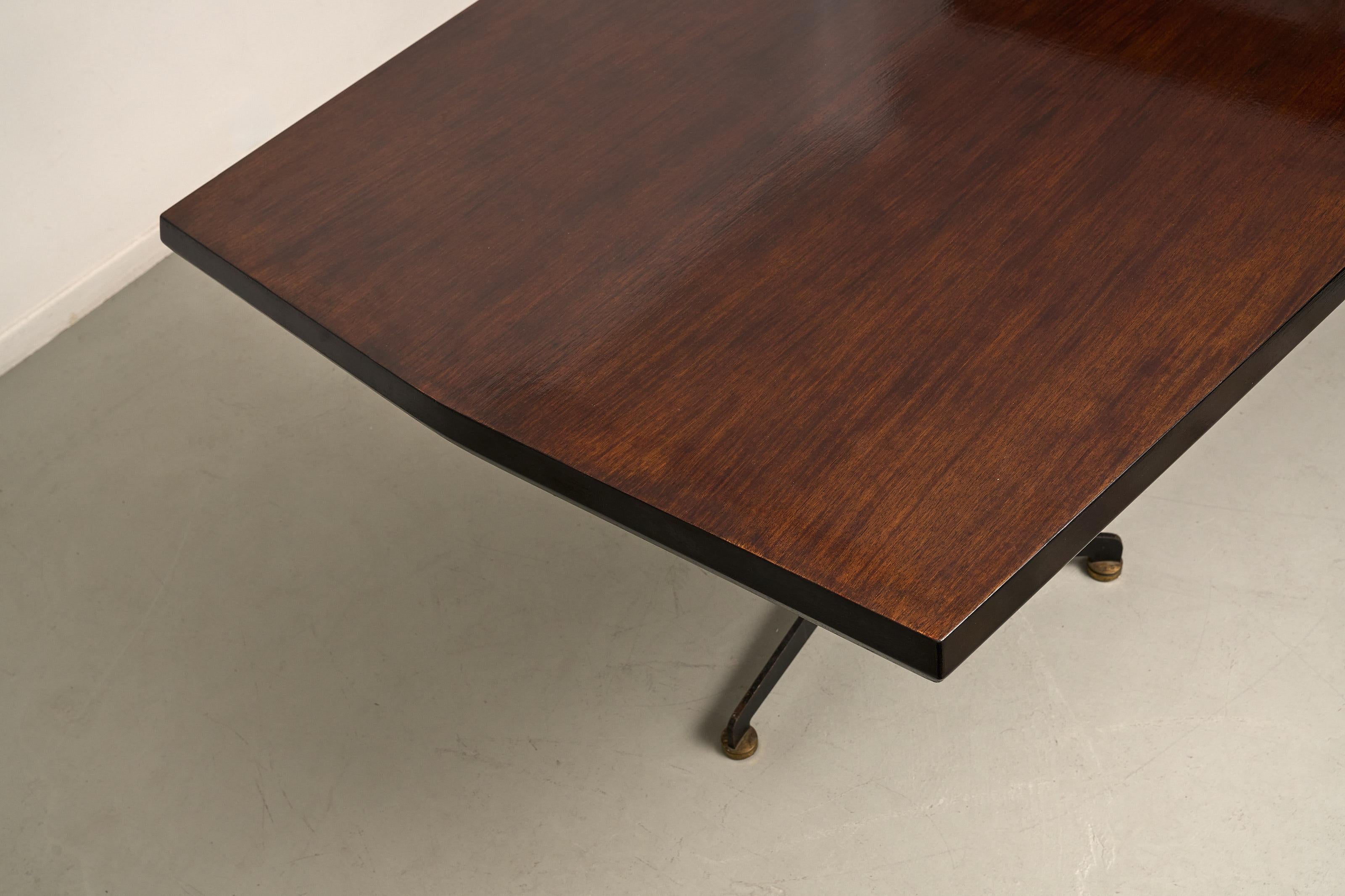 Osvaldo Borsani wood dining table on metallic black legs for Tecno.