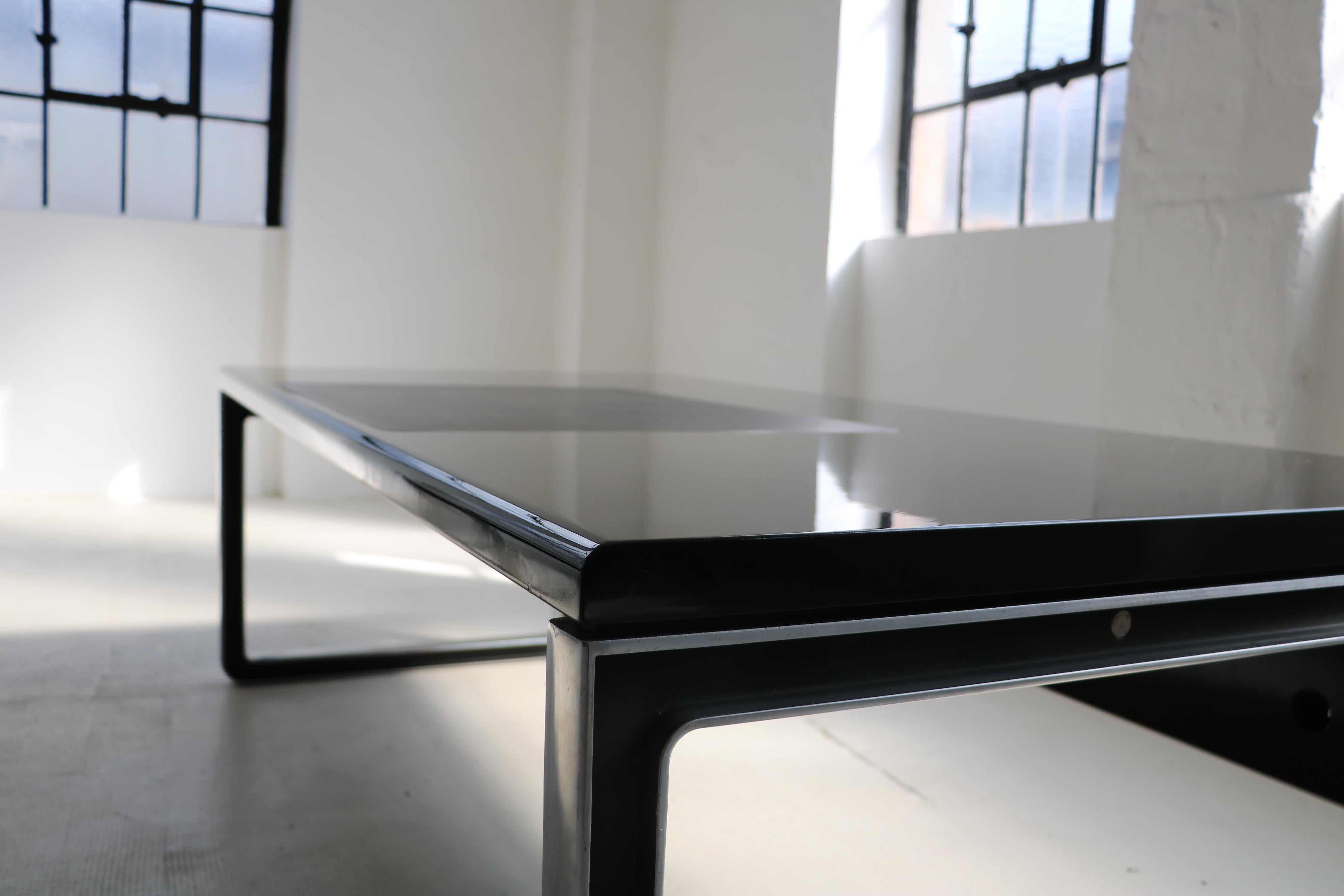 Osvaldo Borsani & Eugenio Gerli desk with leather inlay T333 Tecno 
Frame outside aluminium polished/inside aluminium lacquered black, top wood piano lacquer black with leather inlay black, model T333.

Price applies only to the described