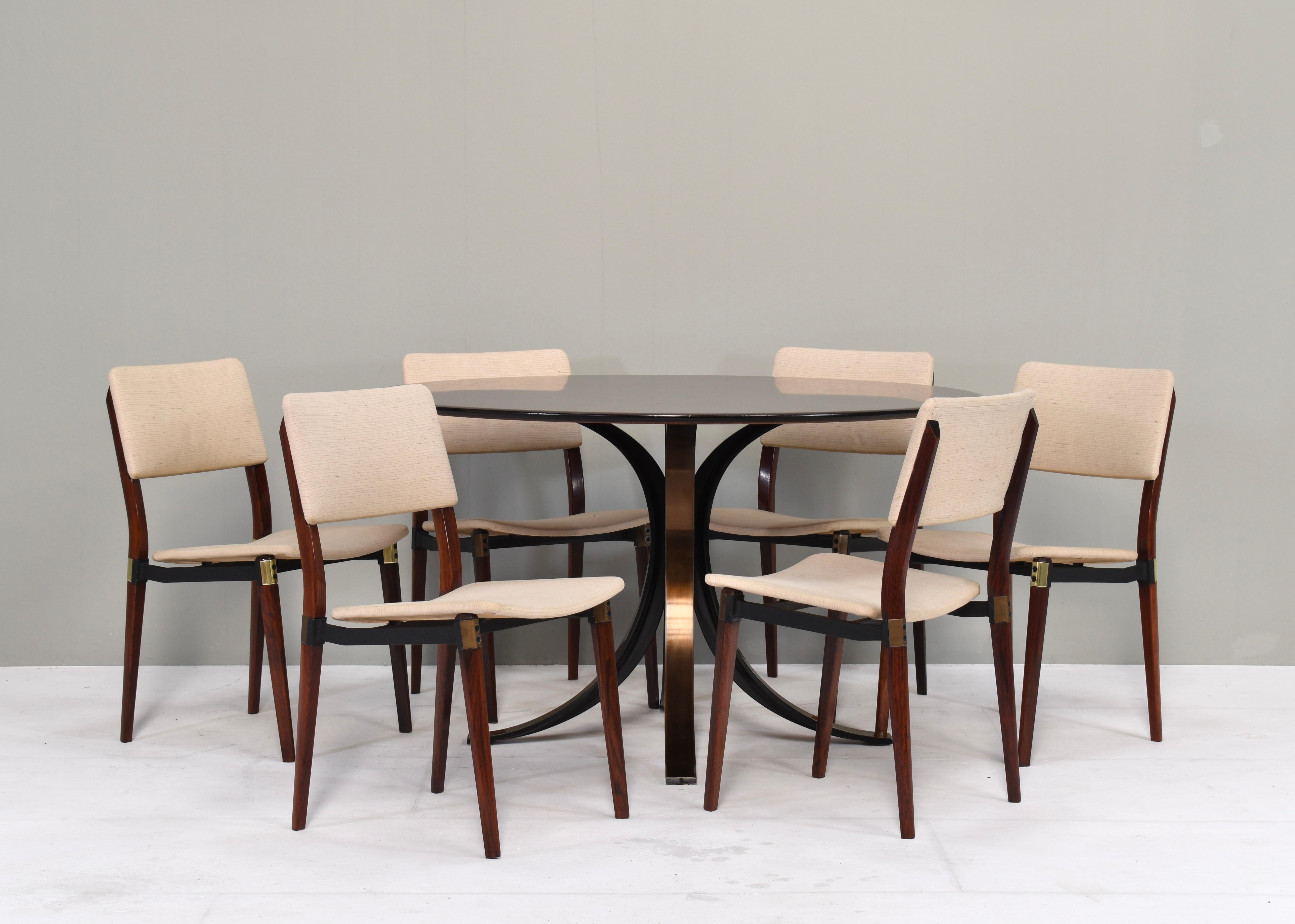 Iconic dining table and six dining chairs by Osvaldo Borsani and Eugenio Gerli for TECNO, Italy, circa 1960. Four chairs have galvanized metal details and two chairs have brass details.
Designer: Osvaldo Borsani & Eugenio Gerli.
Country: