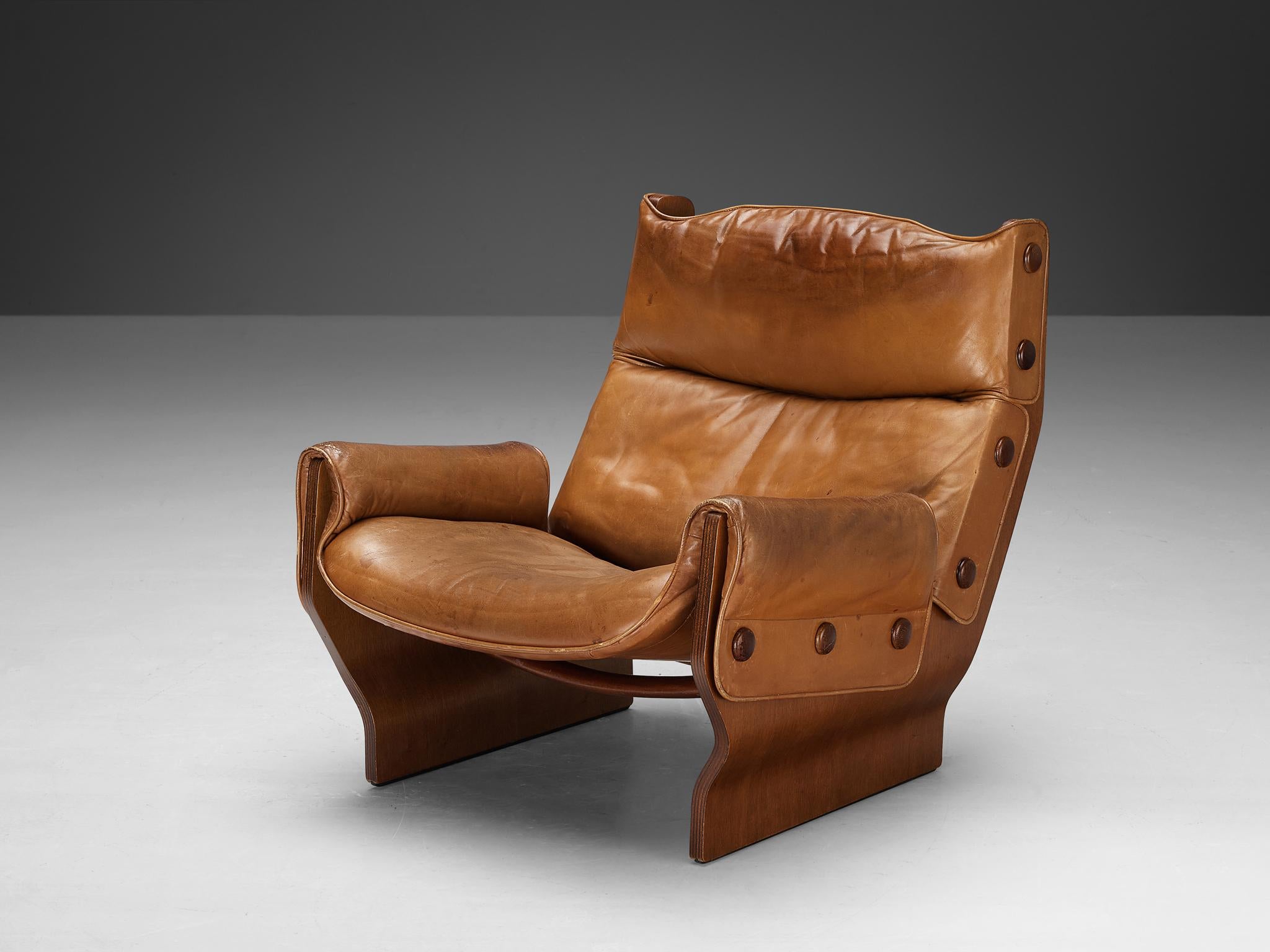 Osvaldo Borsani, Valeria Borsani, and Marco Fantoni for Tecno, 'Canada' lounge chair, model 'T110', leather, mahogany plywood, Italy, 1966

The Canada series was developed from some rough initial sketches by Valeria Borsani and Marco Fantoni while