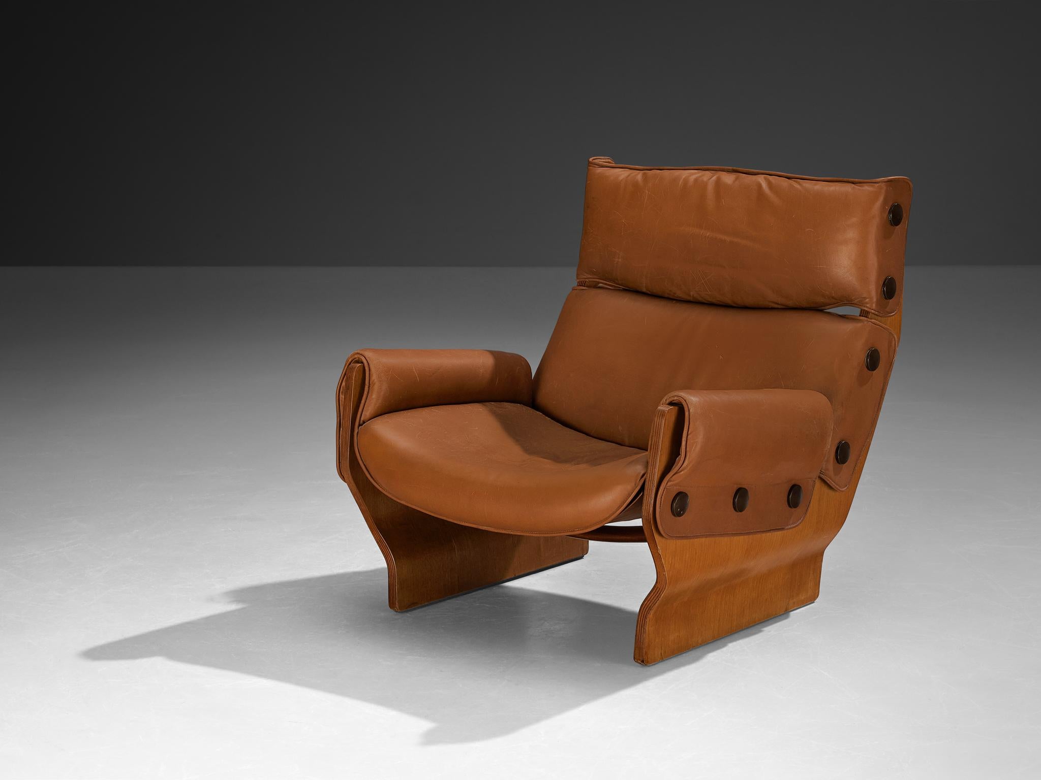Osvaldo Borsani, Valeria Borsani, and Marco Fantoni for Tecno, 'Canada' lounge chair, model 'T110', leather, mahogany plywood, Italy, 1966

The Canada series was developed from some rough initial sketches by Valeria Borsani and Marco Fantoni while