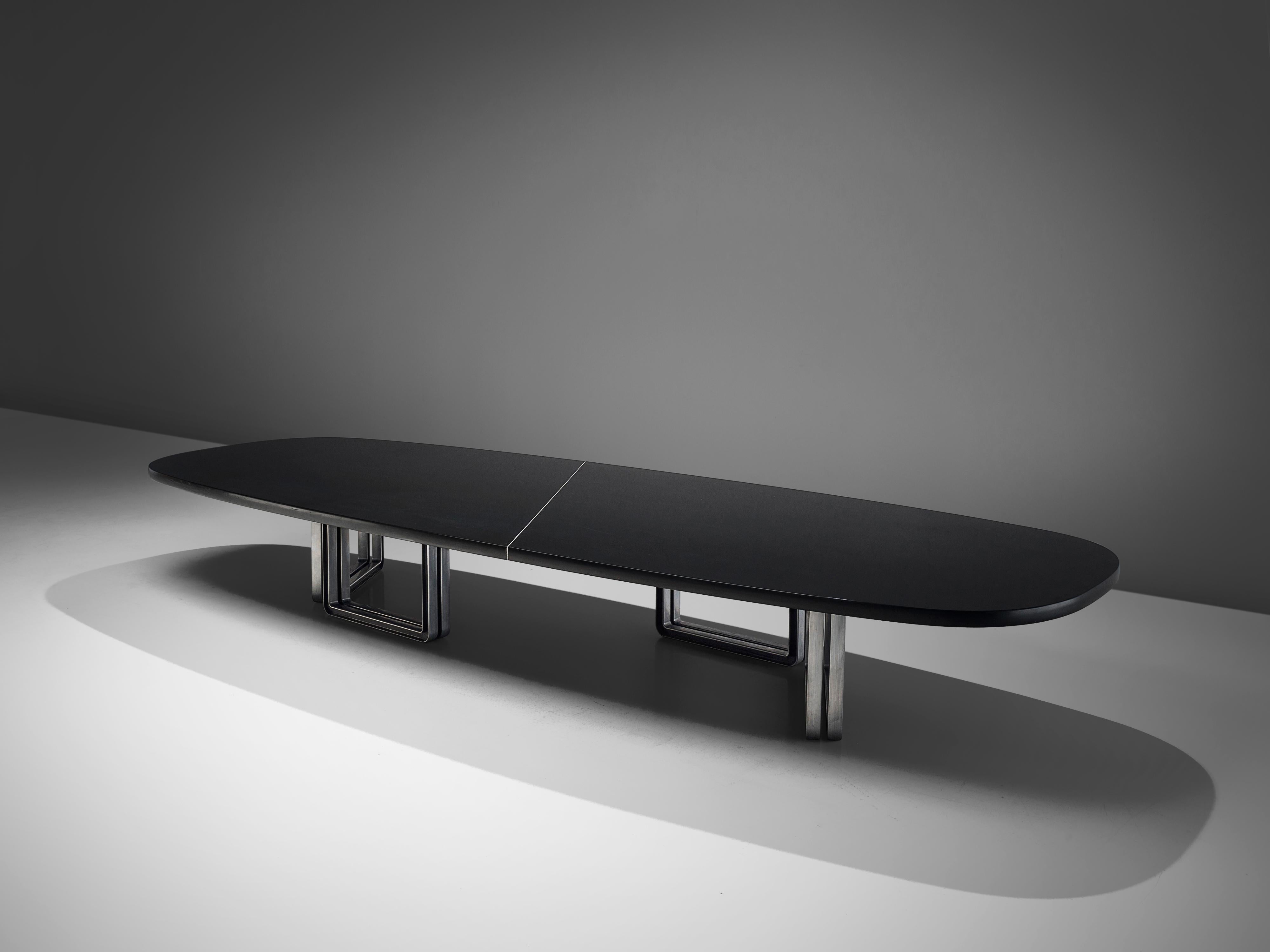 Osvaldo Borsani for Tecno, conference table, lacquered black wood, aluminum base, Italy, 1970s

Conference table with a black top designed by Osvaldo Borsani. The tabletop is composed of two black pieces connected via an expressive line in white