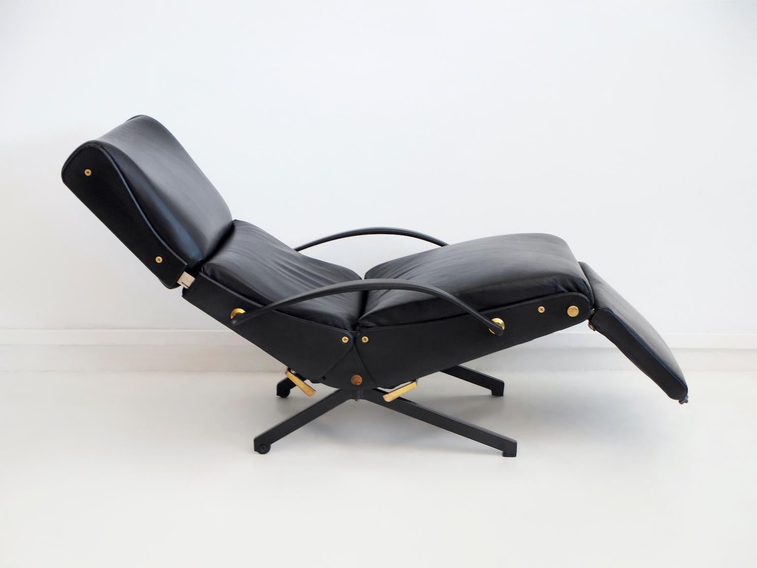 Lounge chair P40, originally designed in 1954 by Osvaldo Borsani for Tecno, Milan. Frame in tubular steel and sheet metal, rubber-coated steel springs, armrests in latex, foam padding, black leather upholstery. The back, seat, headrest and footrest