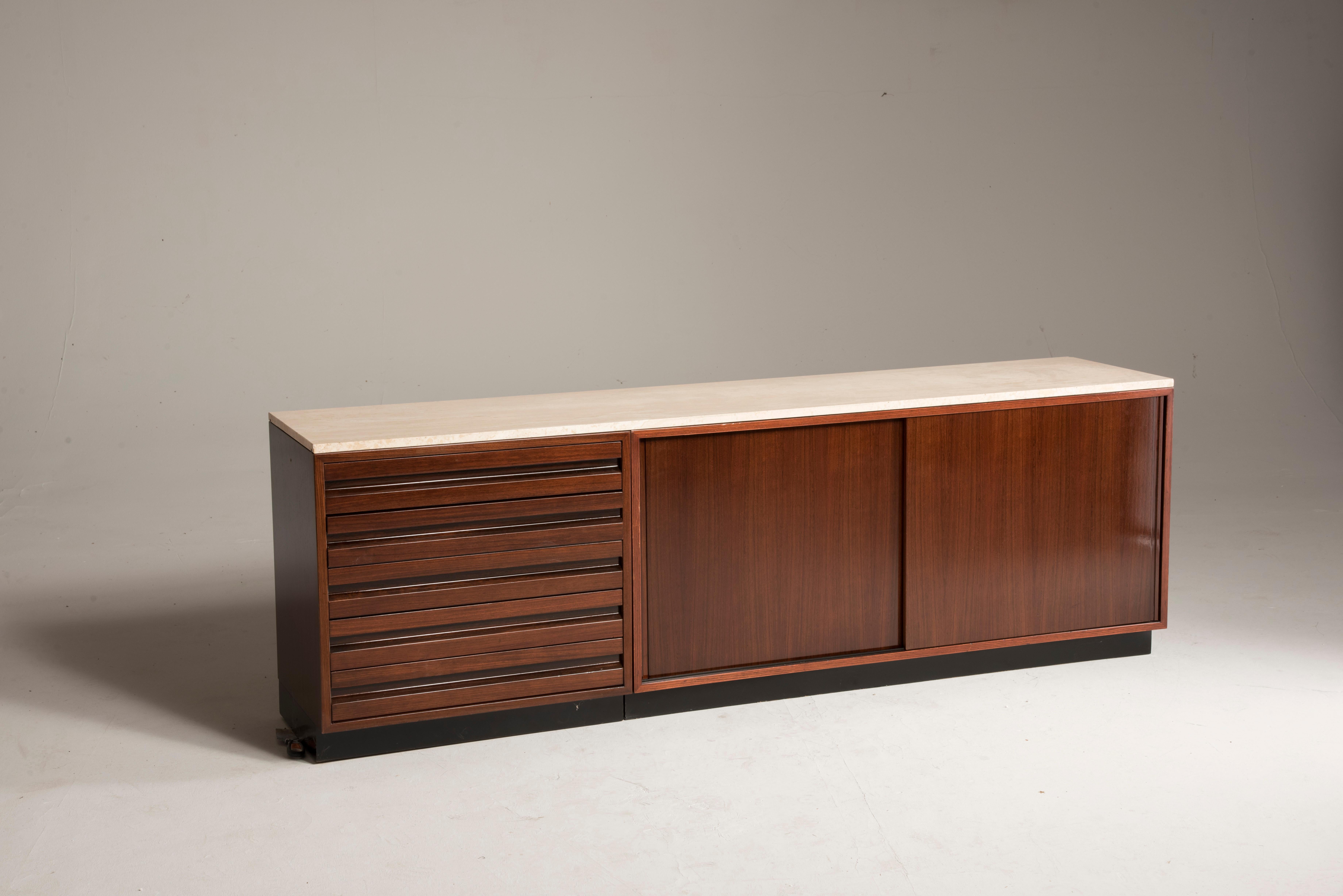 Osvaldo Borsani for Tecno Travertino marble rosewood sliding doors sideboard 
Size: W 210 cm, D 45 cm, H 70 cm
This sideboard has been designed by Osvaldo Borsani for Tecno 
It features two sliding doors and five drawers.
The top is covered by