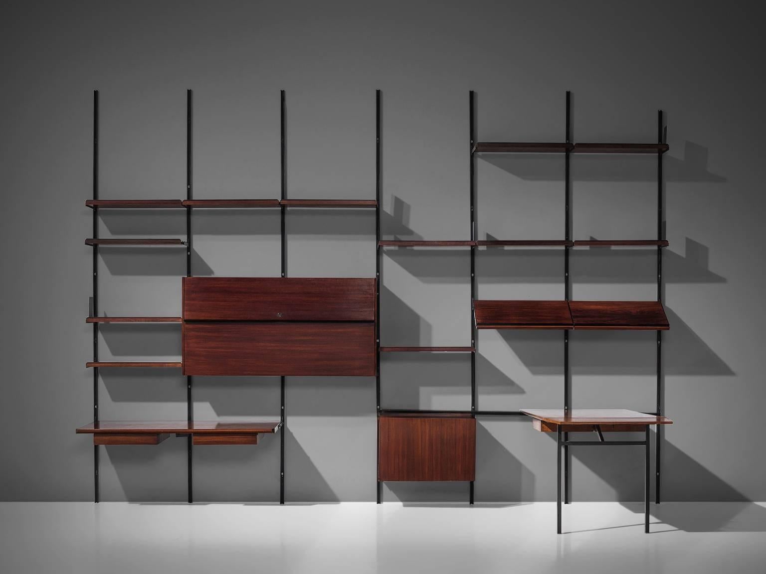 Osvaldo Borsani for Tecno, bookcase or wall unit E22, in metal and rosewood, Italy, 1950s.

This wall-mounted shelving unit is six sections large. This system was developed by Borsani as coordinated system for furnishing either the home or the