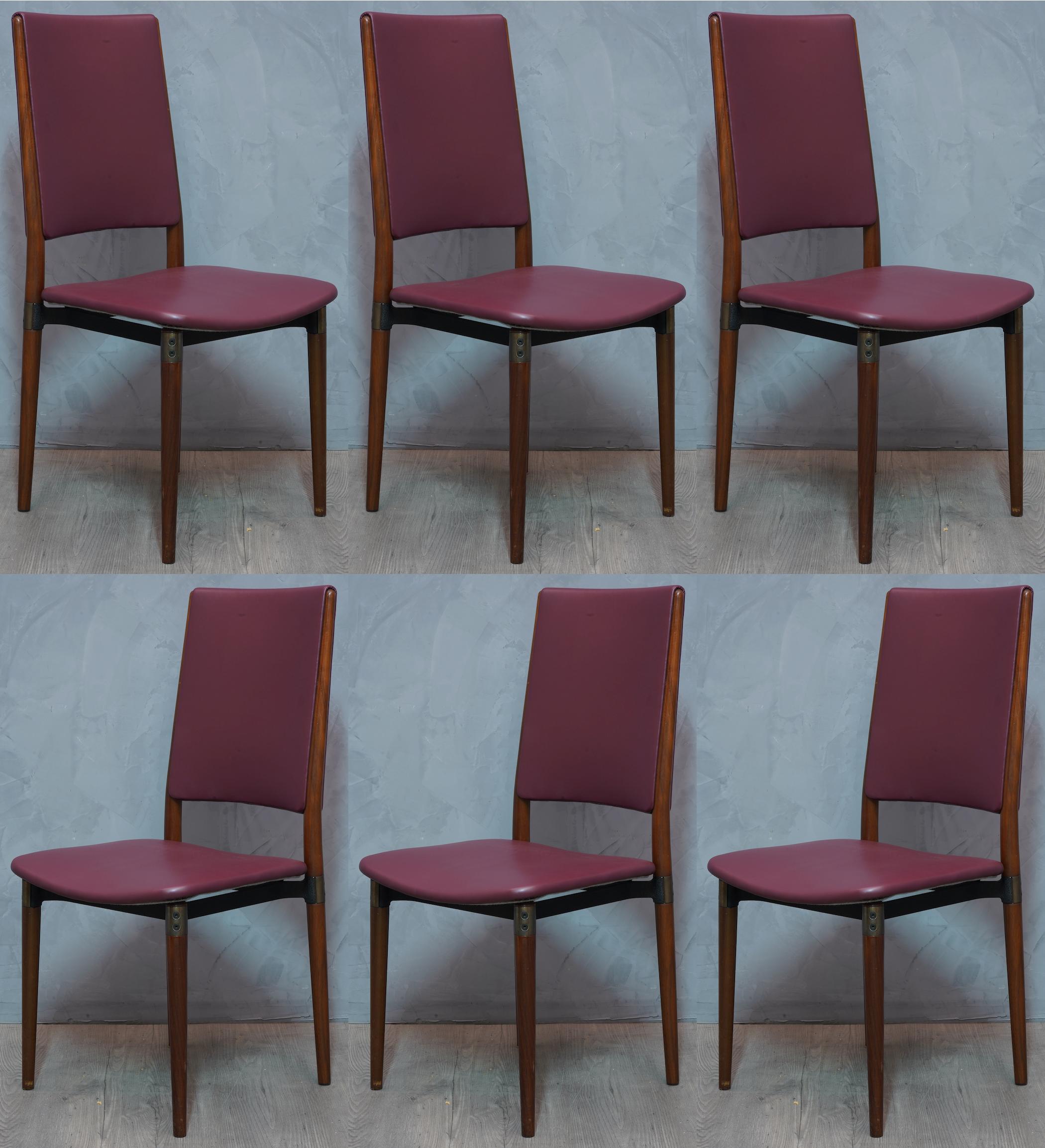 Simple structure but much elegance to this set of 6 chairs of Italian design of the 1950s.

Six Osvaldo Borsani punched Chairs from 1960. All covered in red leather ( the leather is original of the years), with wooden legs, and metal frame. Founder