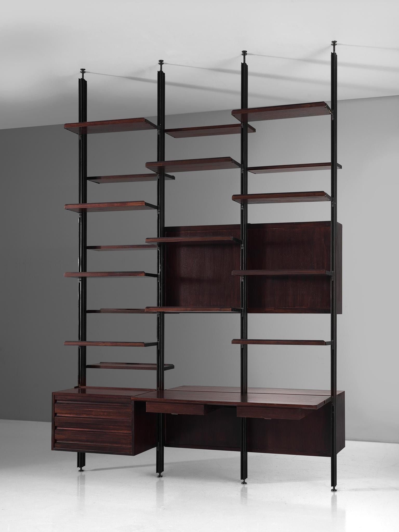 Osvaldo Borsani for Tecno, room divider, metal and darkened wood, Italy, 1950s.

This freestanding shelving unit of three sections on front and back, can be used as a bookcase and a room divider as well. The system was developed by Borsani as