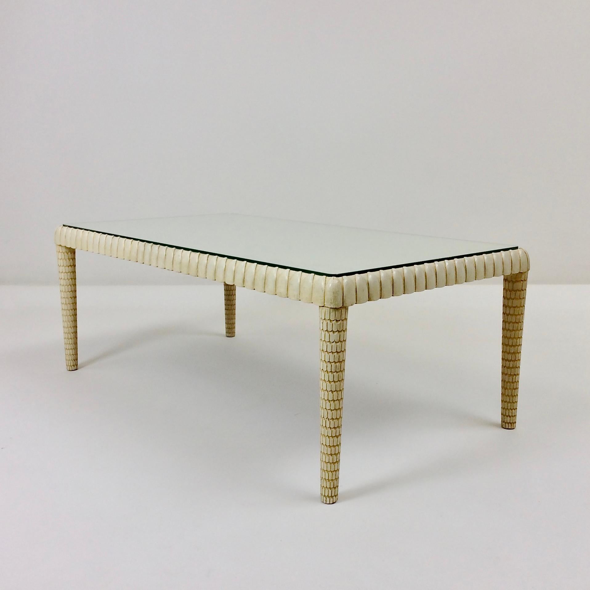 Rare Osvaldo Borsani coffee table edited by Arredamenti Borsani Varedo Milano, circa 1940, Italy.
Ivory painted carved wood, clear glass top.
Signed with applied metal manufacturer's label underside.
Dimensions: 100 cm W, 55 cm D, 38 cm H.
Collector
