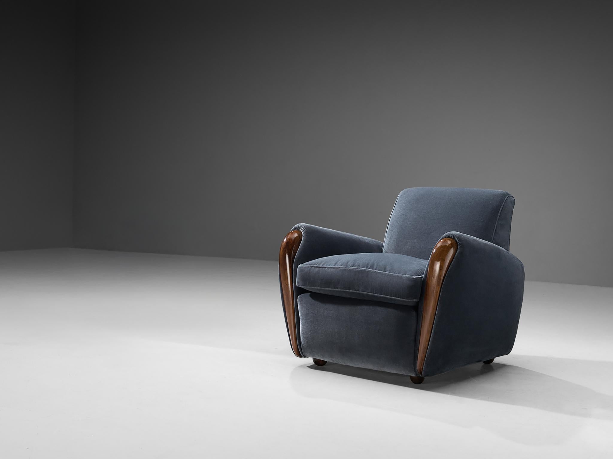 Osvaldo Borsani for Arredamenti Borsani Varedo, lounge chair model 3615, walnut, velvet fabric, Italy, 1941 

A design by Osvaldo Borsani, this easy chair epitomizes a harmonious fusion of subtle contours and graceful curves, showcasing Borsani's
