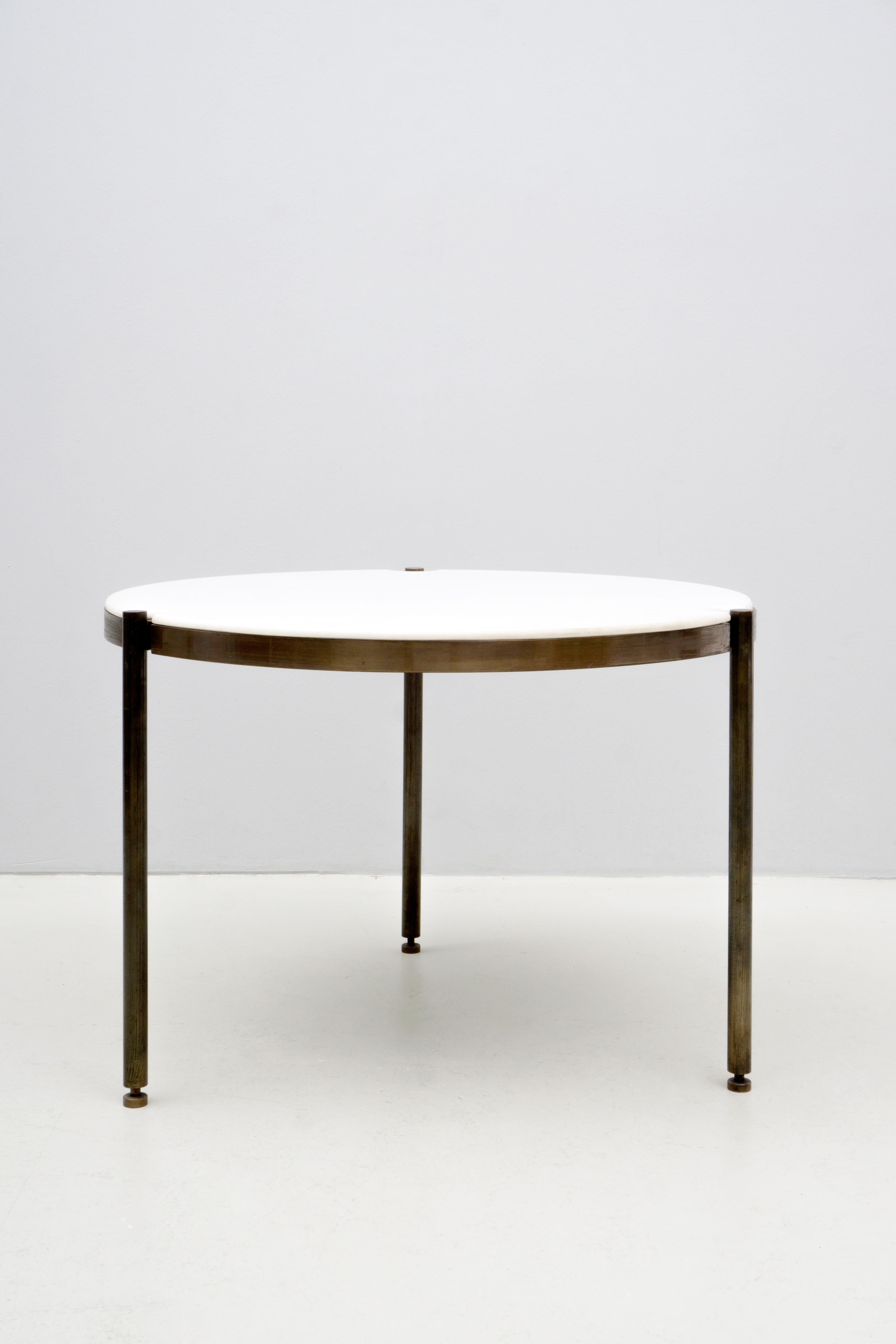 Elegant and minimalistic marble table with a brushed brass construction, originally designed in 1941 by Osvaldo Borsani and manufactured by ABV Arredamento Borsani Varedo.