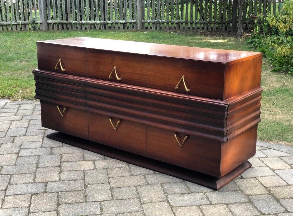 Rare dark walnut Borsani large mid-century dresser with hints of Art Deco style. Features six drawers with
dividers and wishbone shaped brass pulls. Drawers open and close smoothly and the piece is structurally sound. Could use a nice polish.