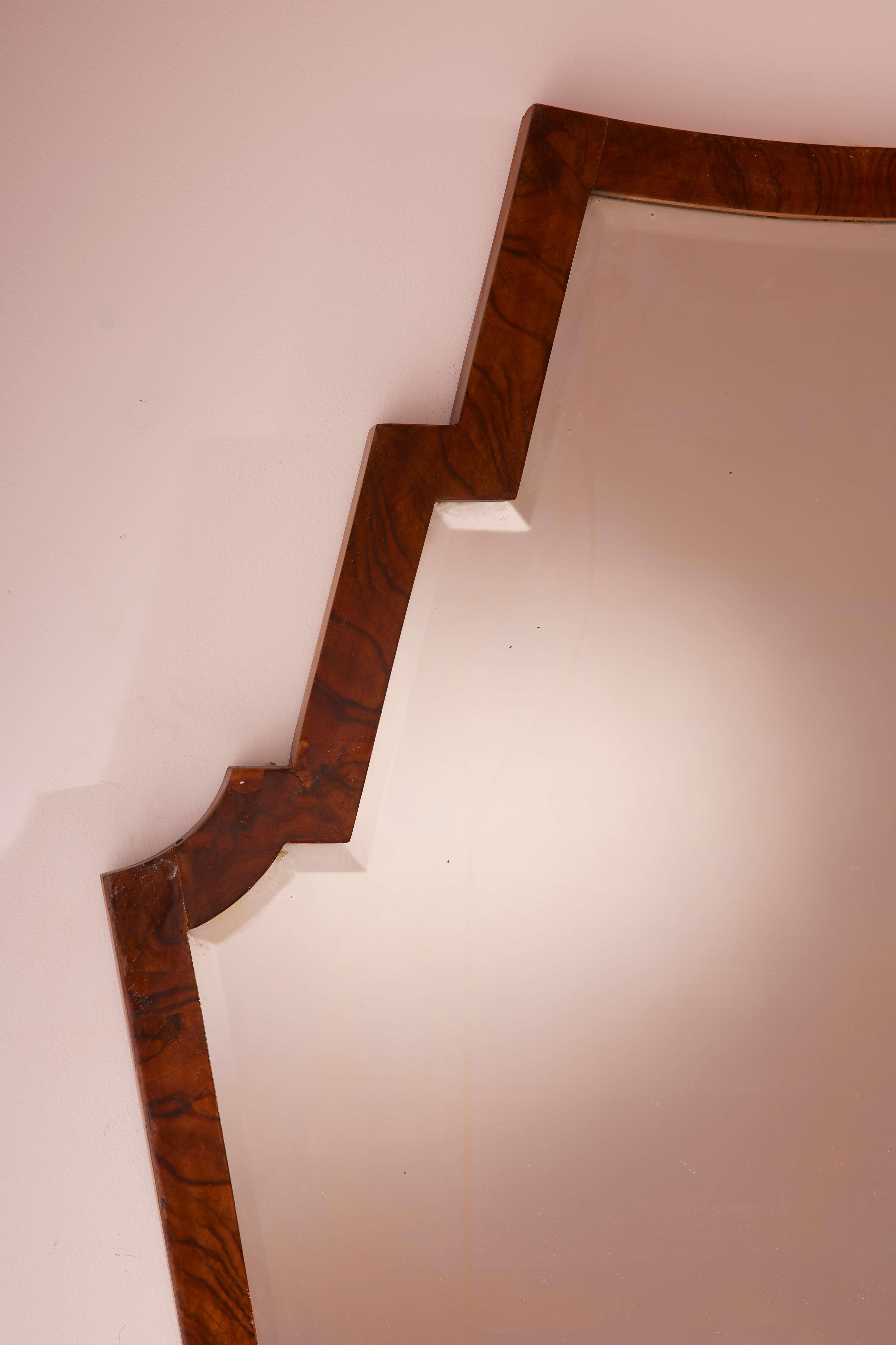 Mid-20th Century Mirror with walnut frame and shaped mirrored glass, Italy, 1940s For Sale