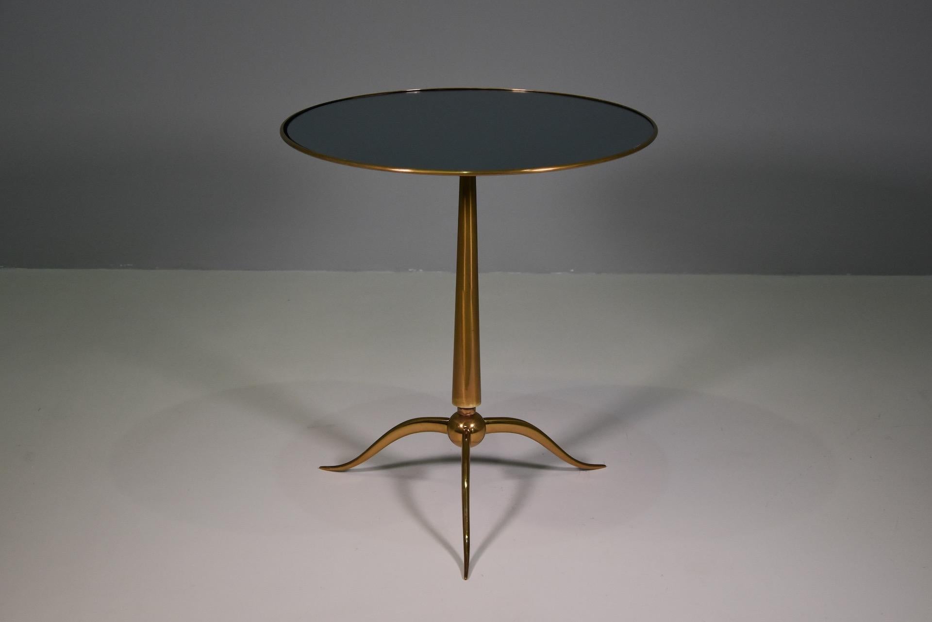 Rareof stunning round side tables with brass top and inset beveled blue glass on elegant brass tripod base, designed by Osvaldo Borsani and manufactured by Arredamenti Borsani Varedo, Milan, 1950s. 
Beautifully elegant lines and proportions in a
