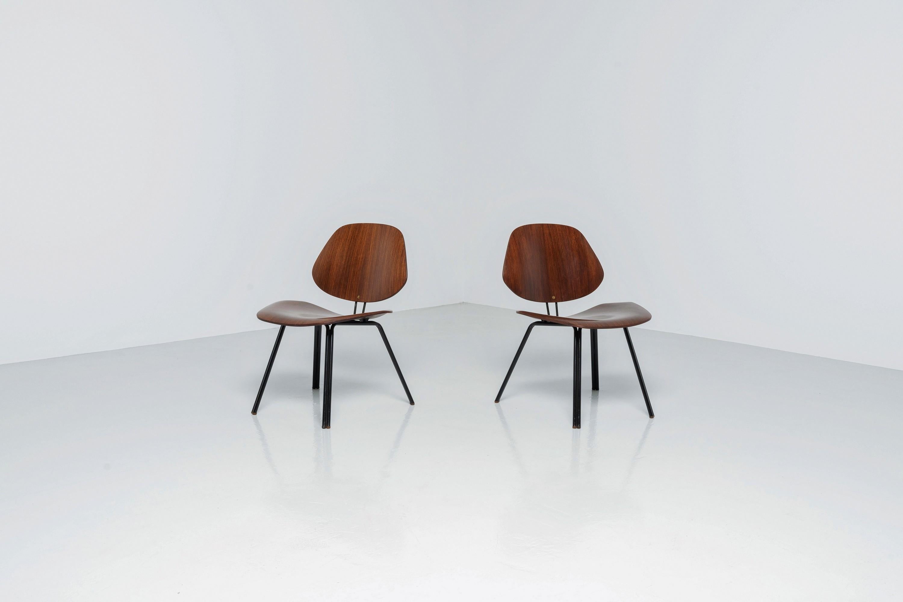Beautiful P31 chairs by Osvaldo Borsani and made in Italy by Tecno in 1957. The chairs are in fully original condition and have a wonderful patina, which only adds value to them. These two chairs are marked with the Tecno emblem on the back, are