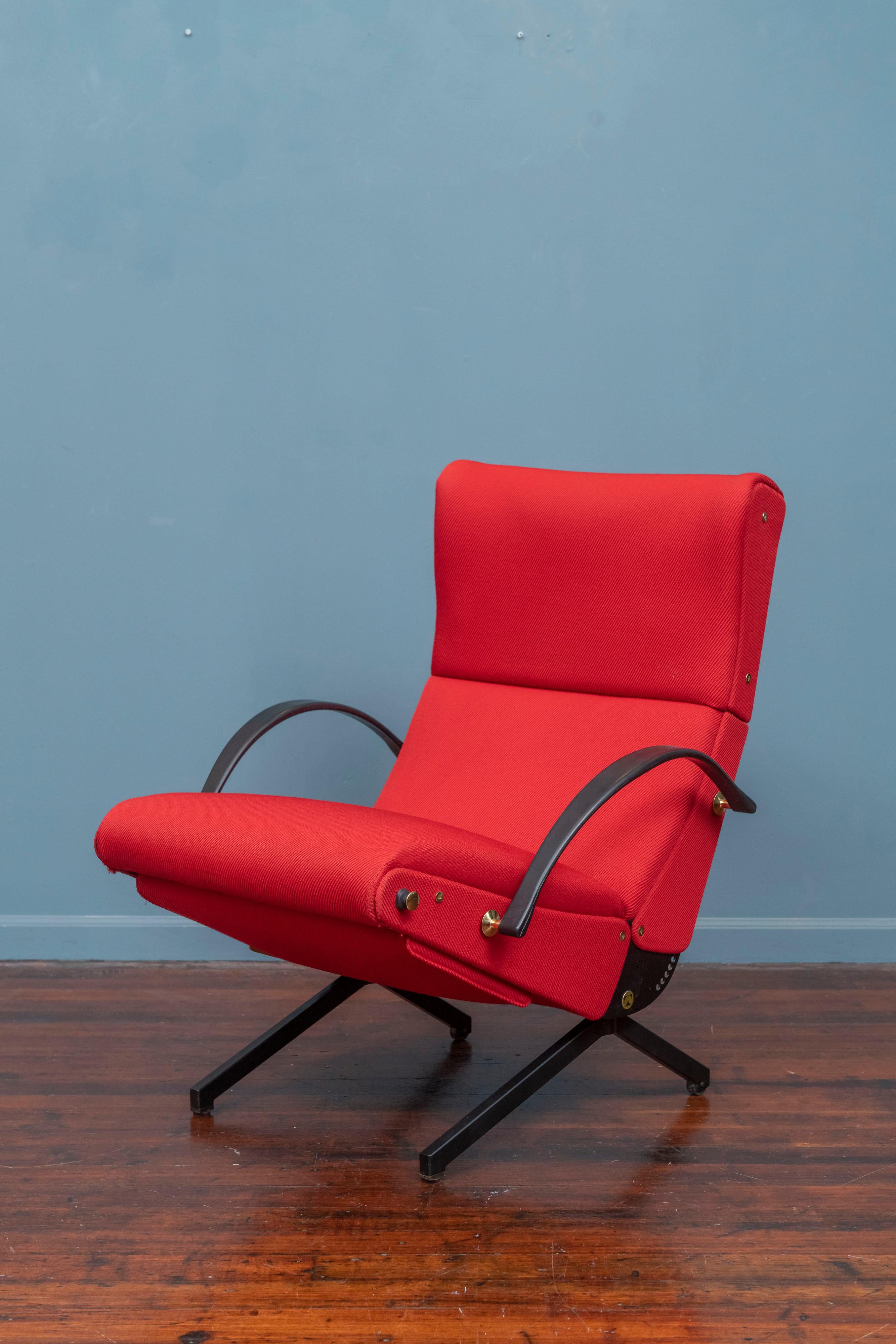 Osvaldo Borsani P40 lounge chair for Tecno, Italy. Newly restored and upholstered in period correct red textured fabric applied on the bias. Iconic design with adjustments for the seat, back and height with a built in foot rest. Rear legs have