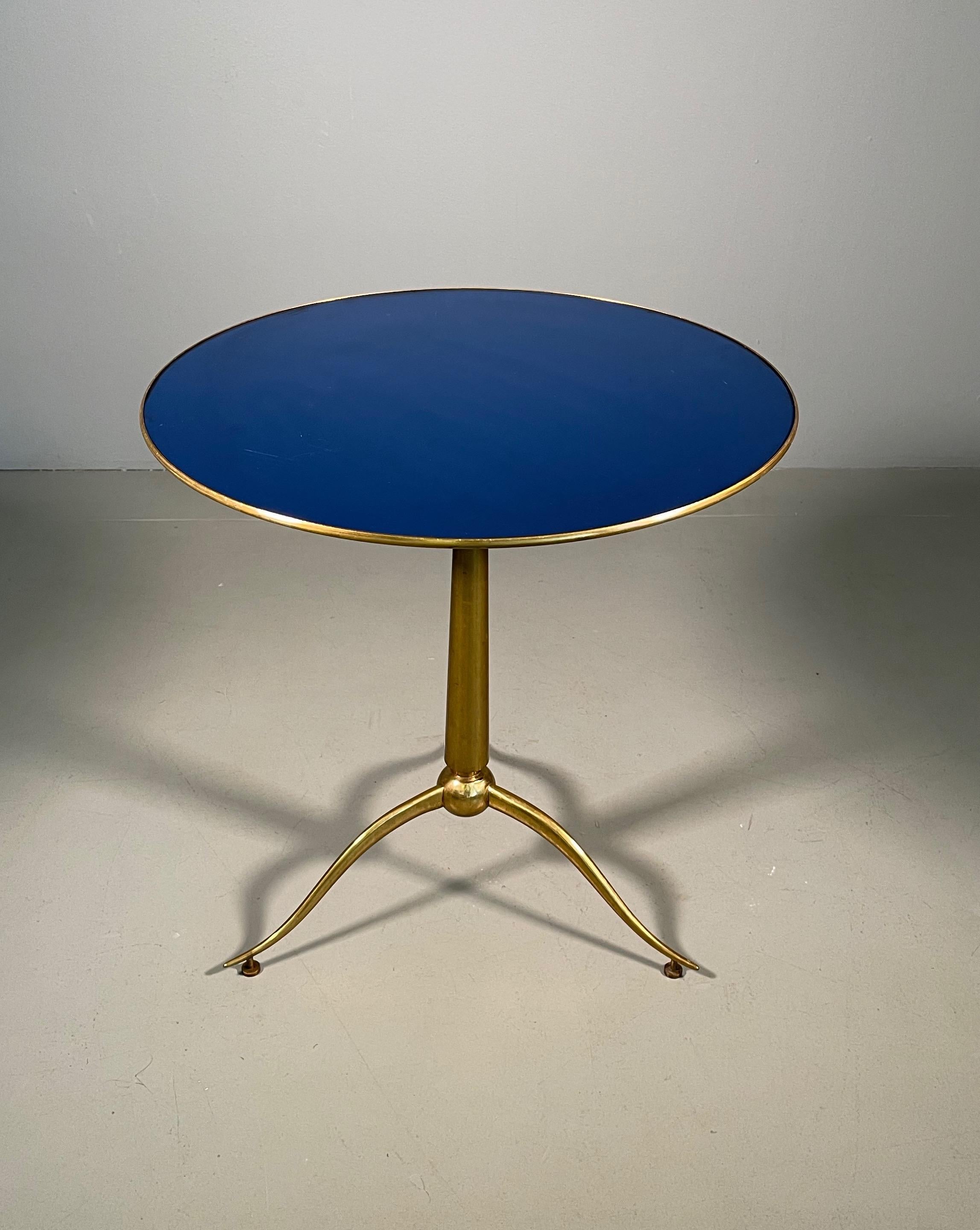 Rareof stunning round side tables with brass top and inset beveled blue glass on elegant brass tripod base, designed by Osvaldo Borsani and manufactured by Arredamenti Borsani Varedo, Milan, 1950s. 
Beautifully elegant lines and proportions in a