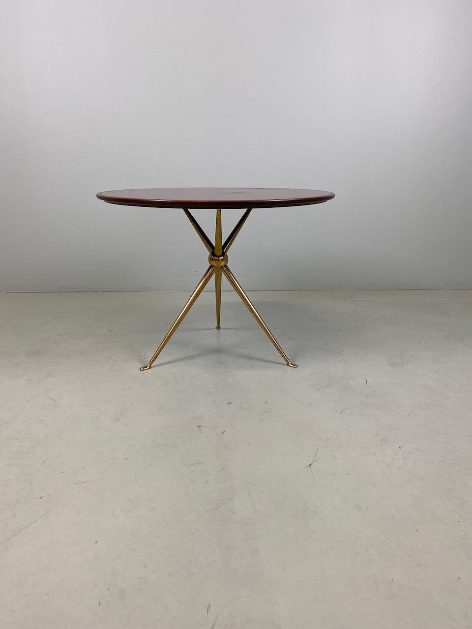 Rare side table with wood top and original inset reverse painted deep red glass gilt brass tripod base, designed by Osvaldo Borsani and manufactured by Arredamenti Borsani Varedo, Milano.