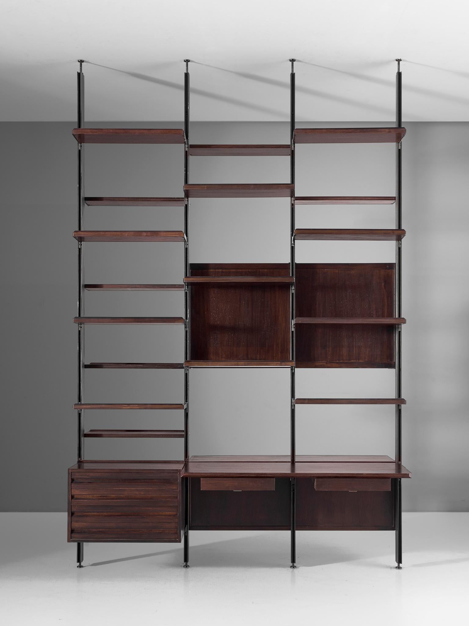 Osvaldo Borsani for Tecno, room divider 'E 22', metal and darkened wood, Italy, 1950s.

This freestanding shelving unit is an adjustable room divider. The flexible system was developed by Borsani for furnishing either the home or the office. The
