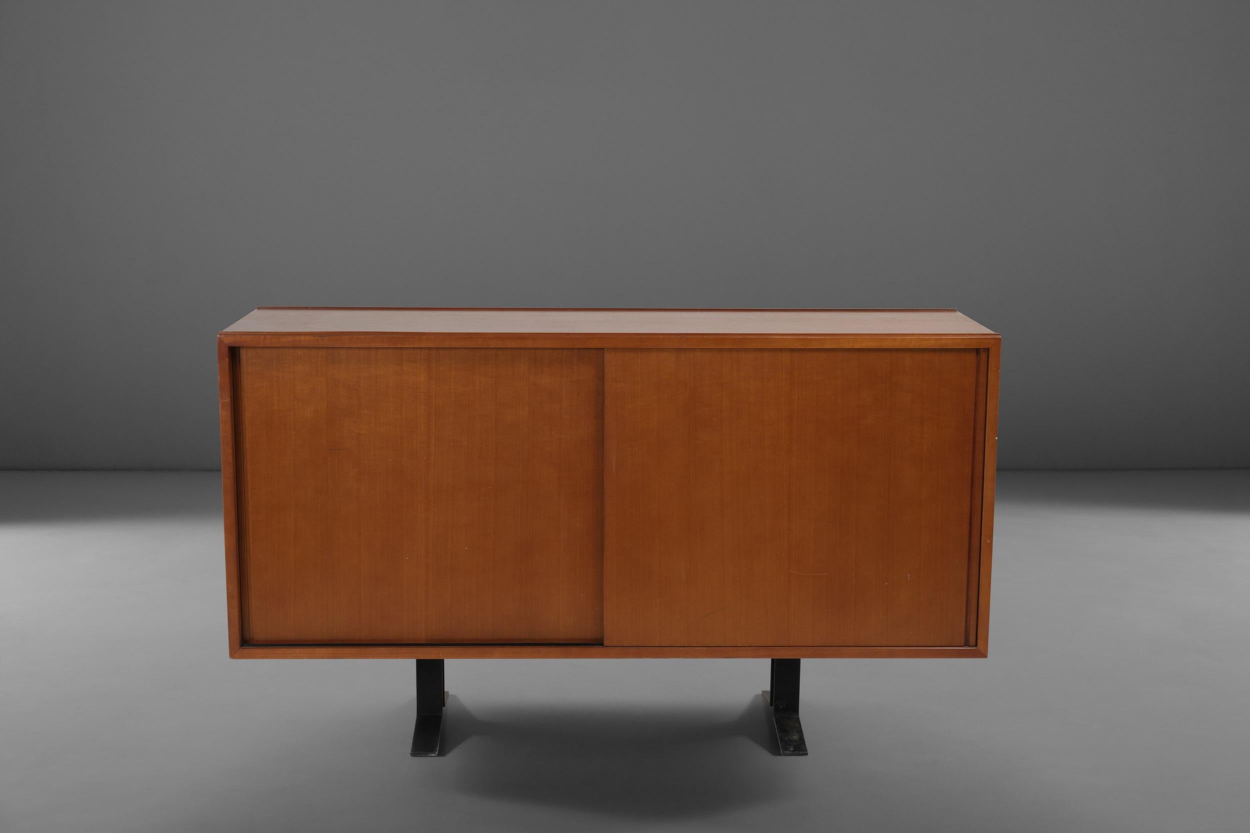 This rosewood sideboard model SE3 featuring two sliding doors was designed by Osvaldo Borsani for Tecno in 1962. 
Functionality and essential shapes are the keywords around which this item has been conceived, a true must-have for lovers of interior