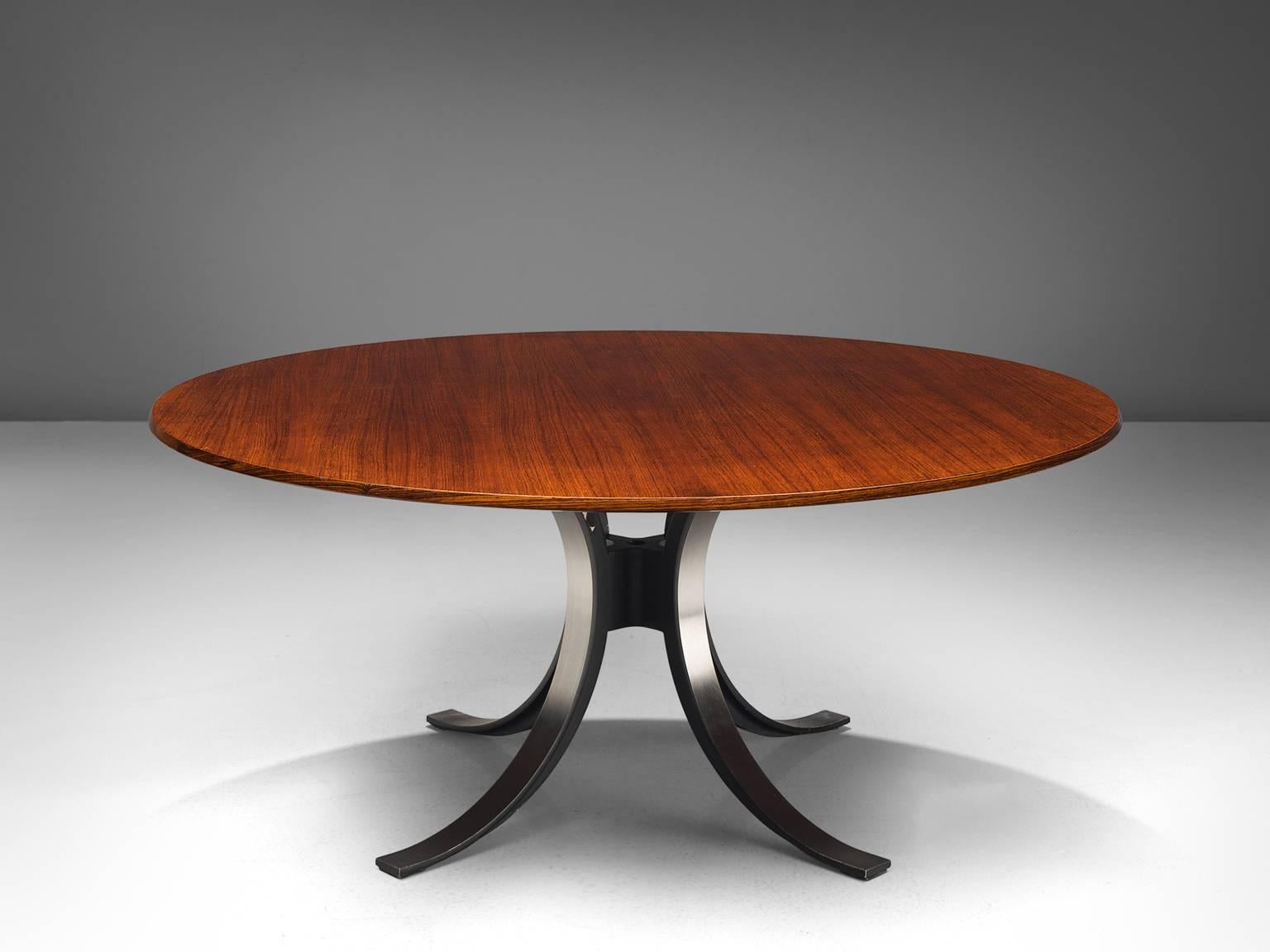 Osvaldo Borsani and Eugenio Gerli for Tecno, T-69 Dining table, rosewood, steel, Italy, 1965.

Round dining table with rosewood top and metal base. Characteristic on this table is the base. Consisting of four C-shaped legs. These semicircles