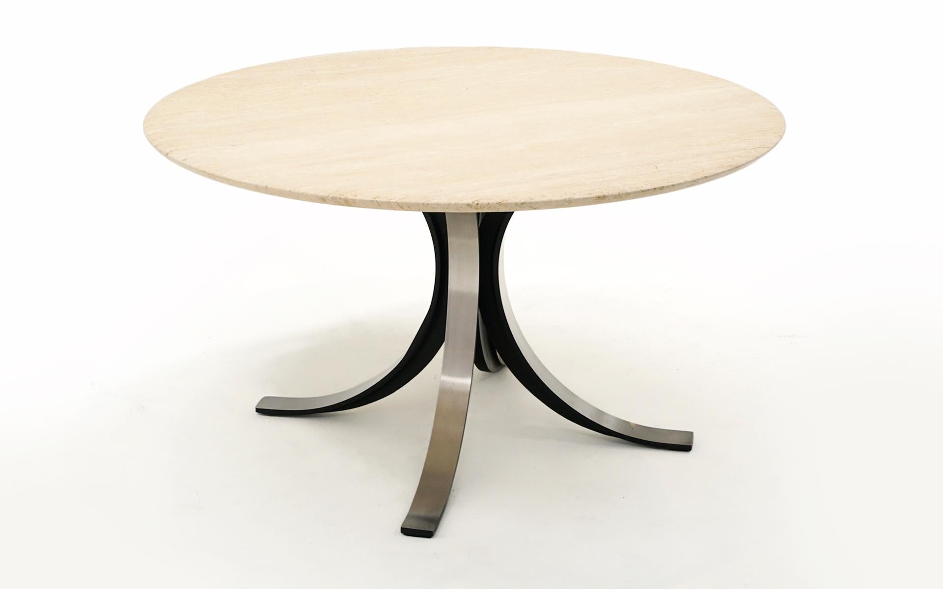 Osvaldo Borsani dining table or center table or game table with the original one inch thick travertine top with slightly tapered edge. Black steel base with aluminum panels. There is one water ring on the travertine that is only visible in raking
