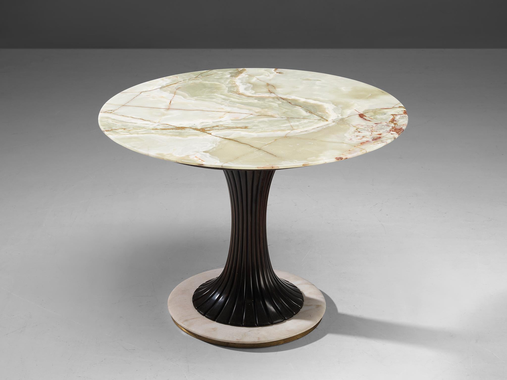 Osvaldo Borsani for Arredamenti Borsani, table, wood, onyx, marble, brass, Italy, 1950s.

This charming table features an hourglass shaped pedestal with classical elements carved in the wood. The base is executed in white marble and adorned with a