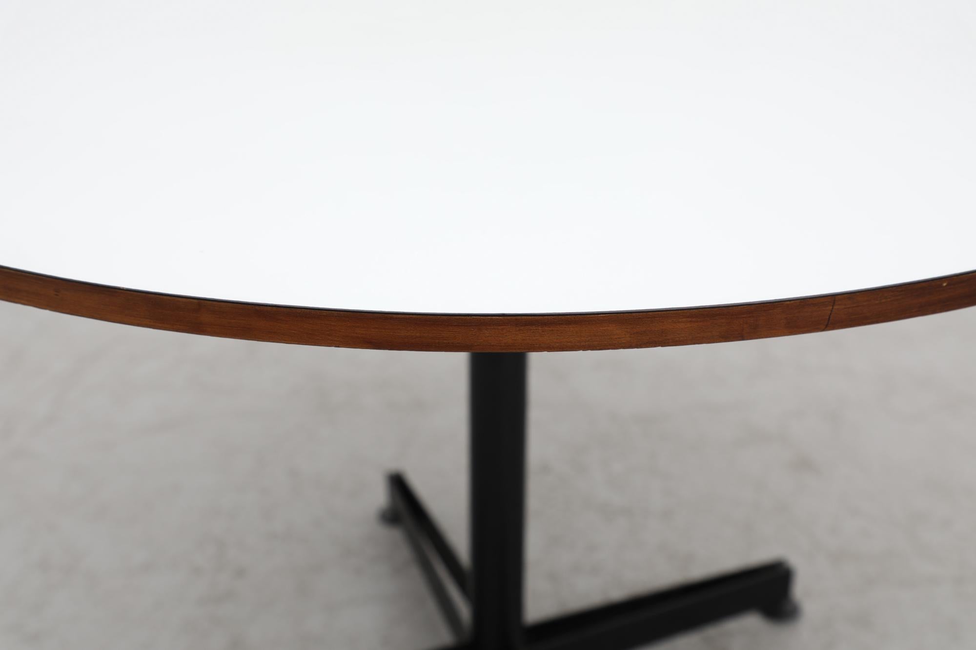 Mid-20th Century Osvaldo Borsani Round Pedestal Table White Laminate Top, Teak Edge & Black Base For Sale