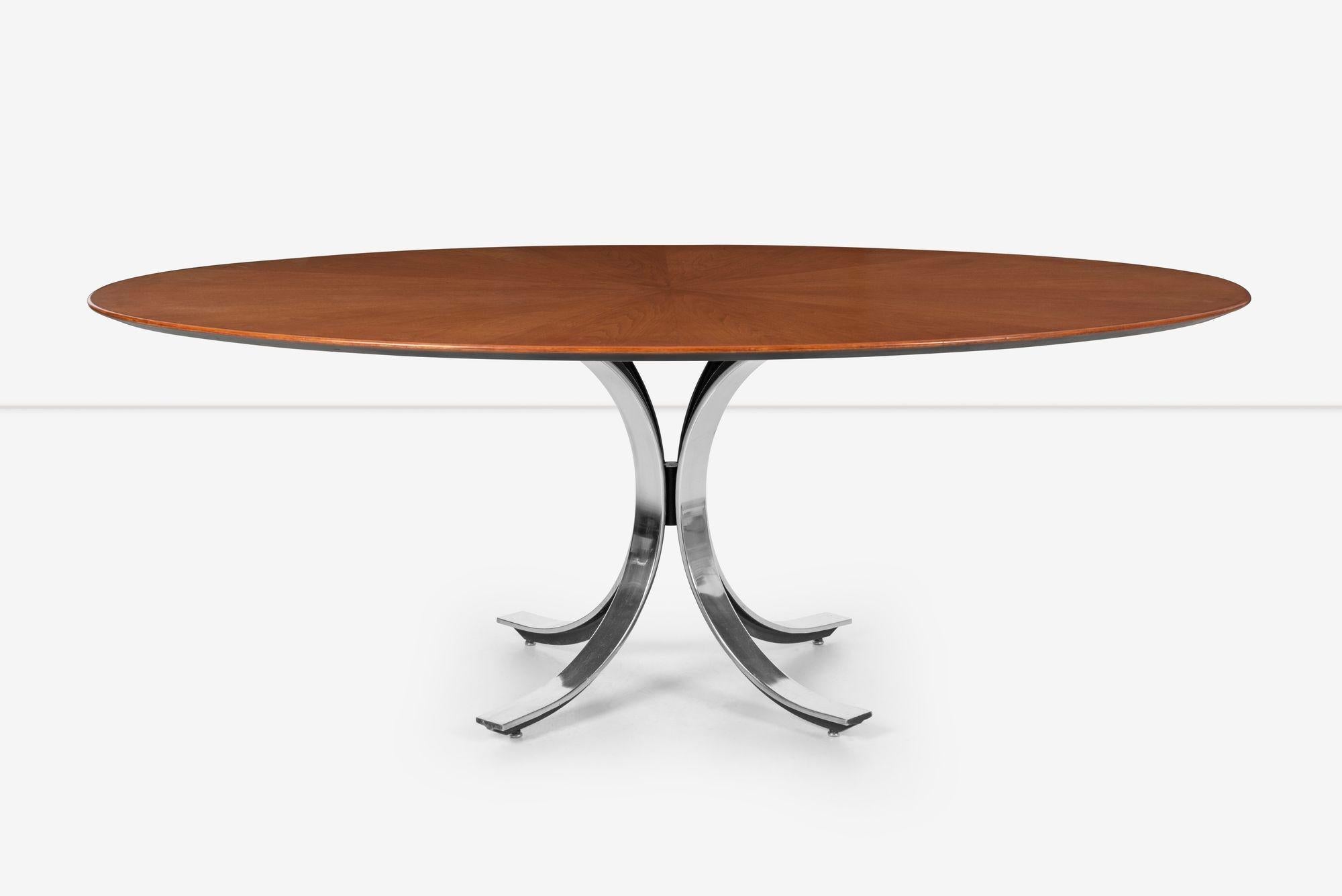 Osvaldo Borsani Style Dining Table, Polished stainless steel splayed legs with beveled top with geometric patterned teak veneer design.
 