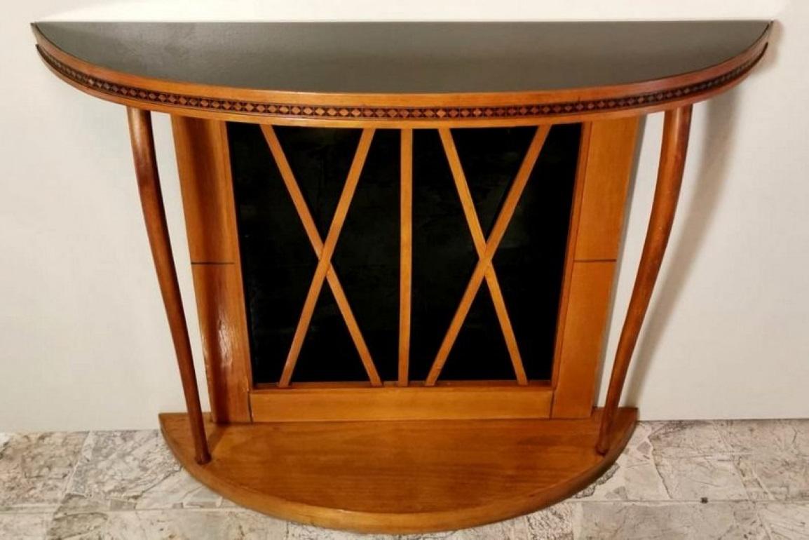 We kindly suggest you read the whole description, because with it we try to give you detailed technical and historical information to guarantee the authenticity of our objects.
Pretty and particular cherrywood console table; it is finished with