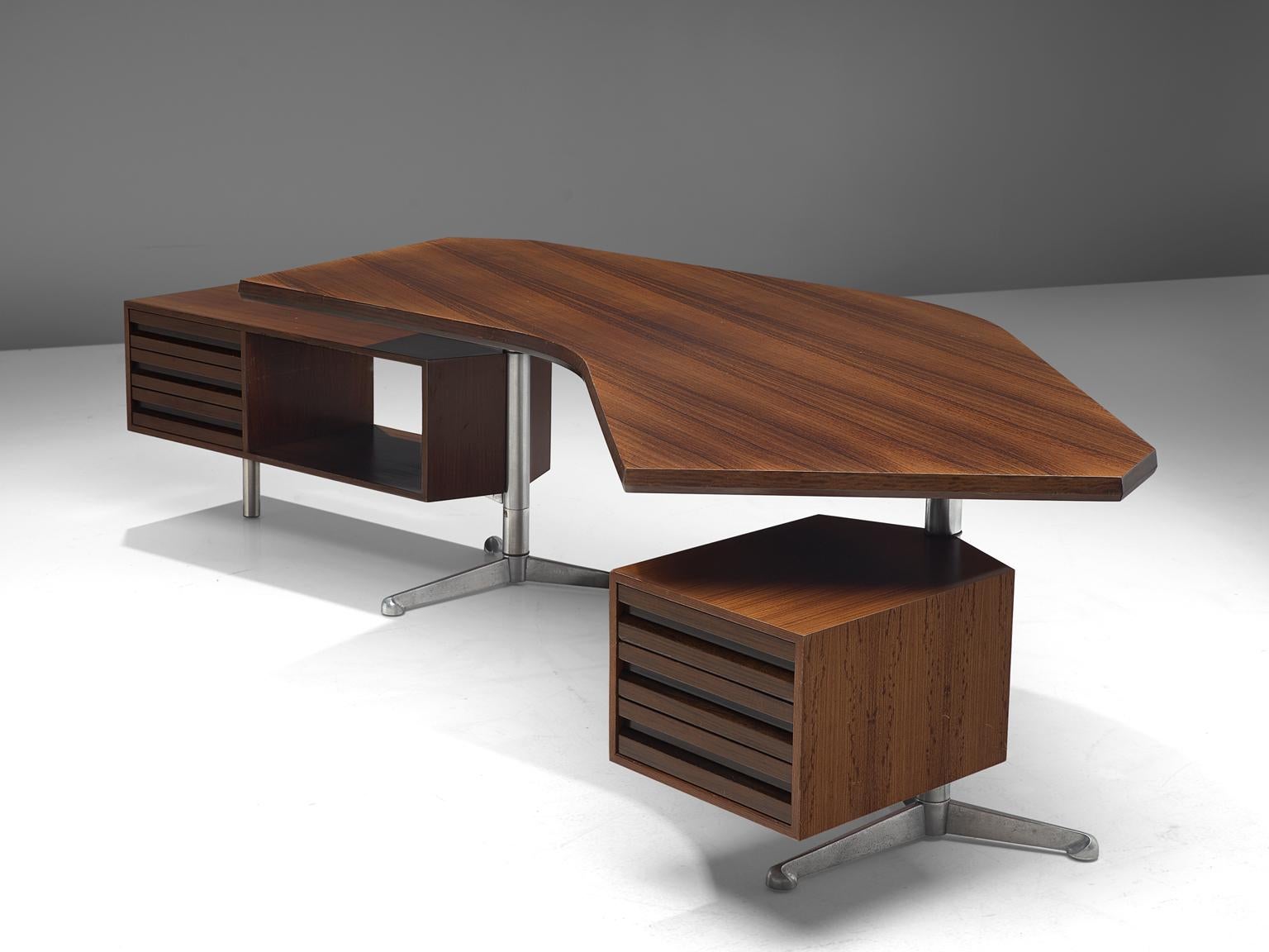 Osvaldo Borsani for Tecno, desk T-96 'Boomerang', rosewood, metal, Italy 1956. 

This boomerang shaped desk is designed by Osvaldo Borsani. The two revolving cabinets are held in place by the characteristic stainless steel tripods. The top has the