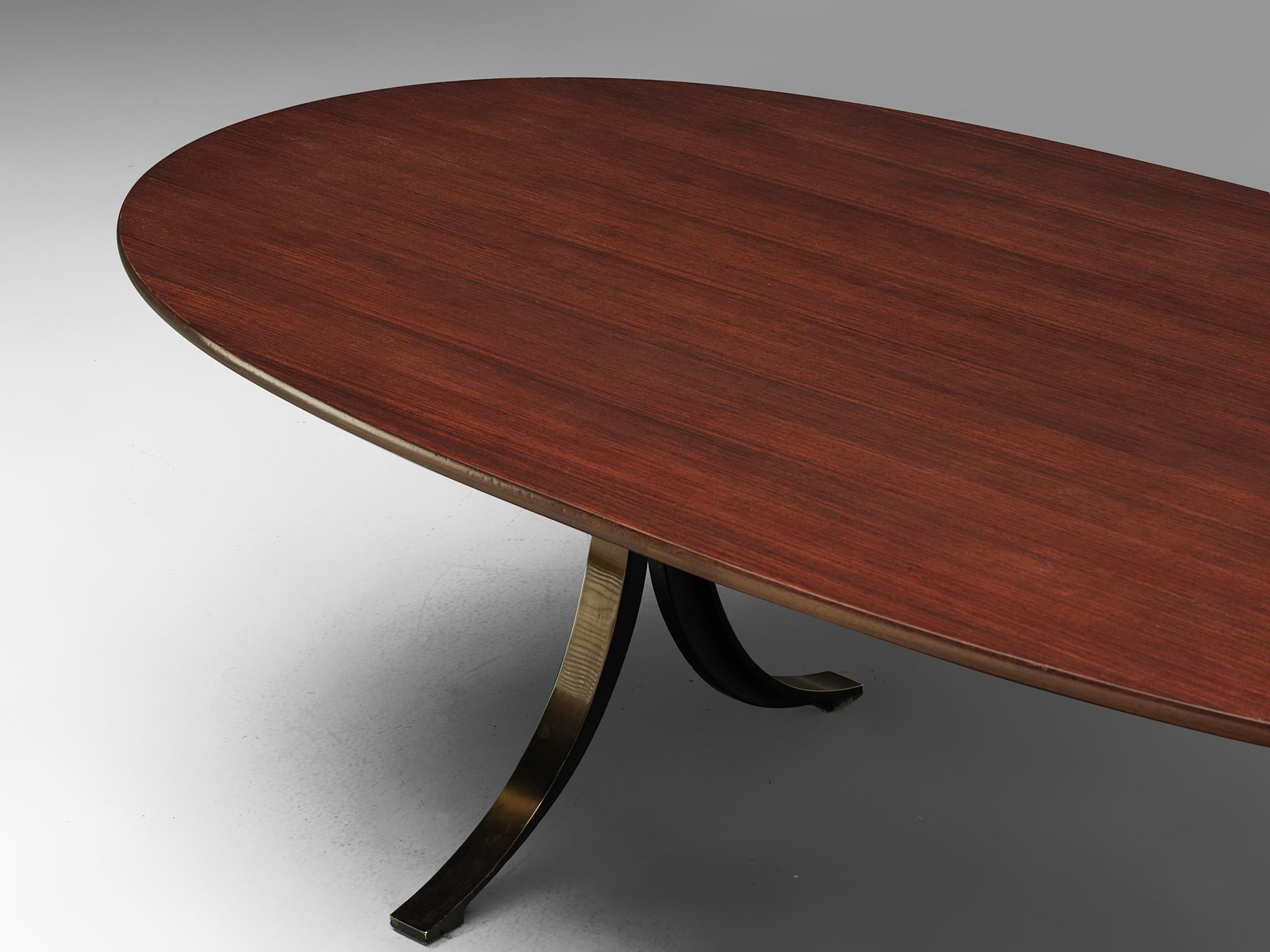 Osvaldo Borsani and Eugenio Gerli for Tecno, T102 dining or conference table, teak and steel, Italy, 1964. 

Oval dining table with teak top and copper colored, metal base. Characteristic on this table is the base, which consist of four C-shaped