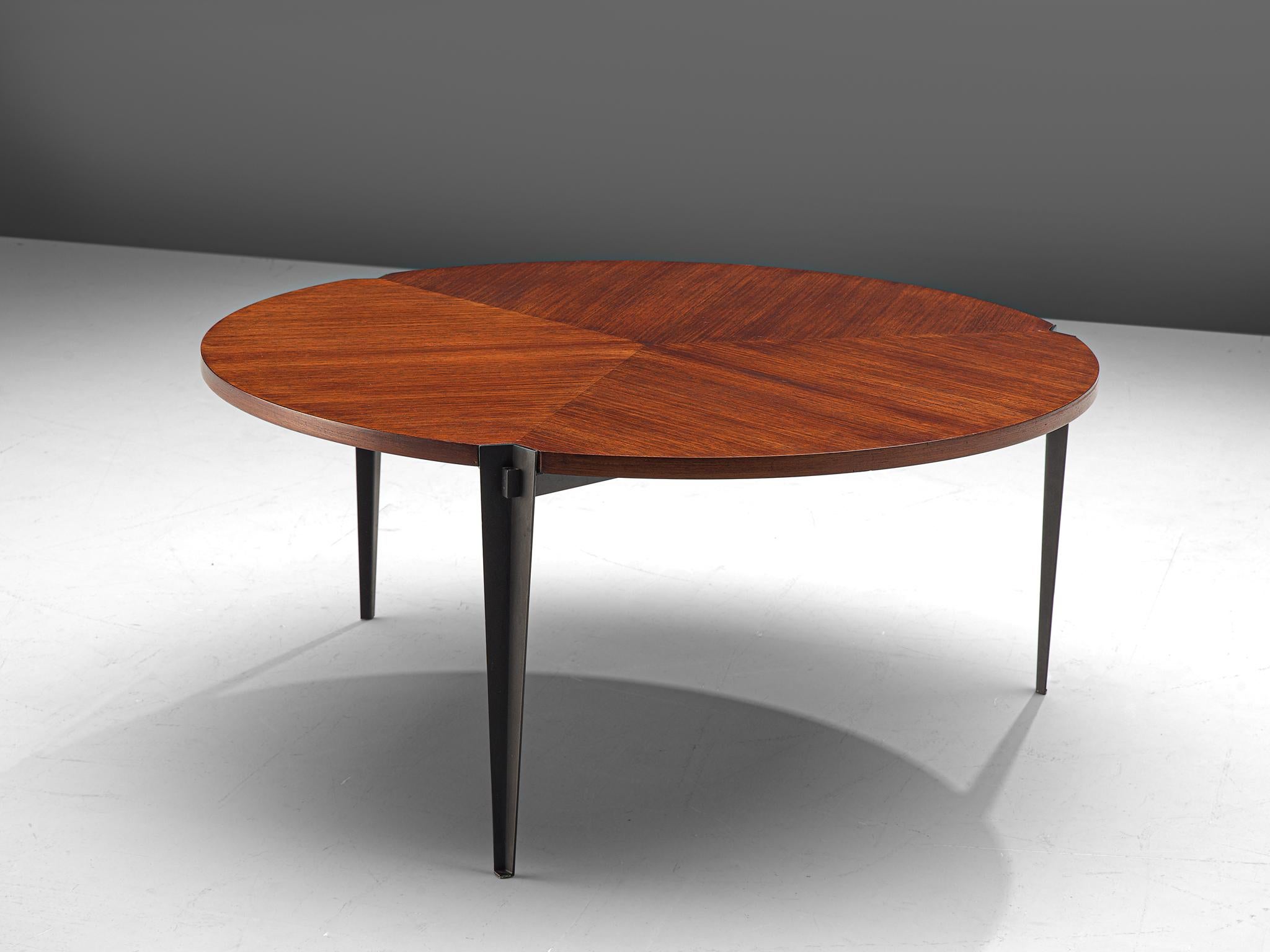 Osvaldo Borsani for Tecno, coffee table model 'T61', teak and metal, Italy, 1957.

Elegant coffee tables, designed by Osvaldo Borsani and produced by Tecno. The table has a round tabletop of teak veneer, which is inlayed in a triangular shape. The