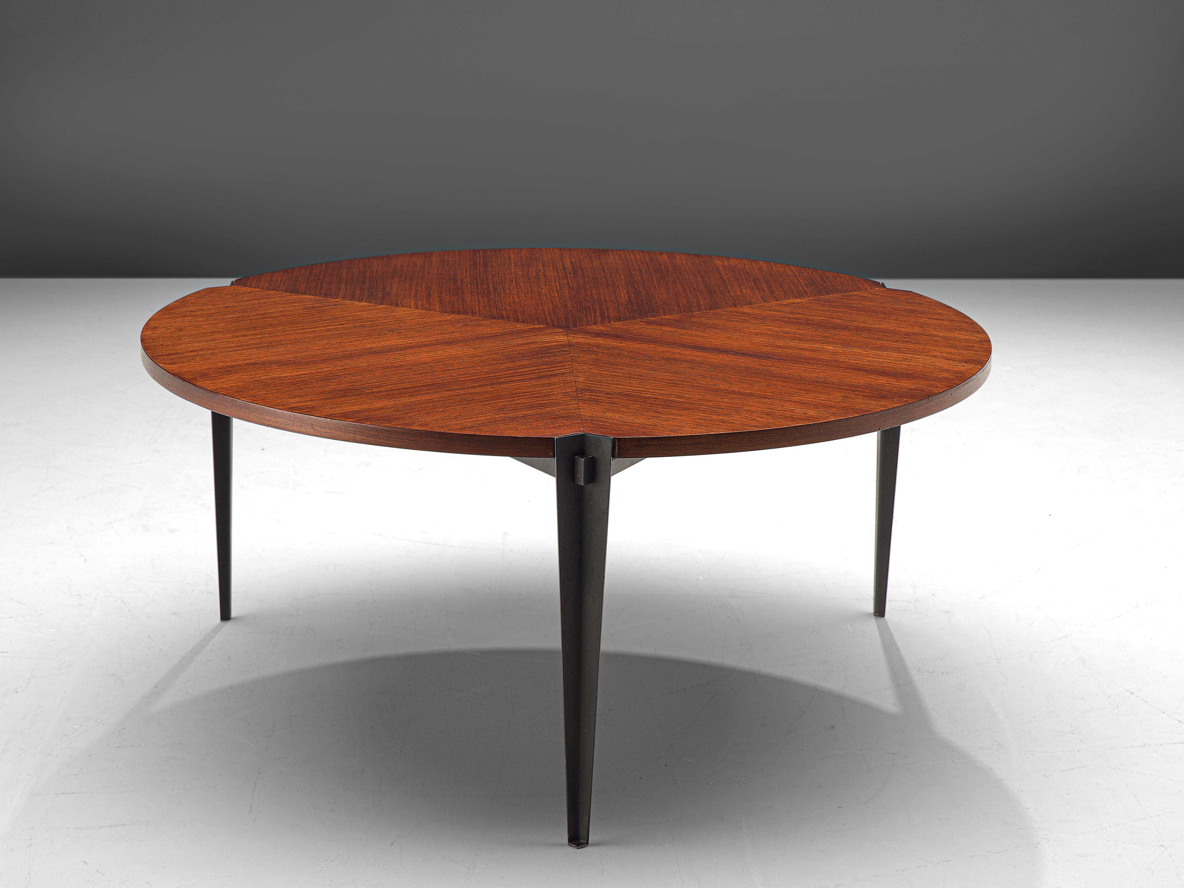 Osvaldo Borsani for Tecno, coffee table model 'T61', teak and metal, Italy, 1957.

Elegant coffee tables, designed by Osvaldo Borsani and produced by Tecno. The table has a round tabletop of teak veneer, which is inlayed in a triangular shape. The