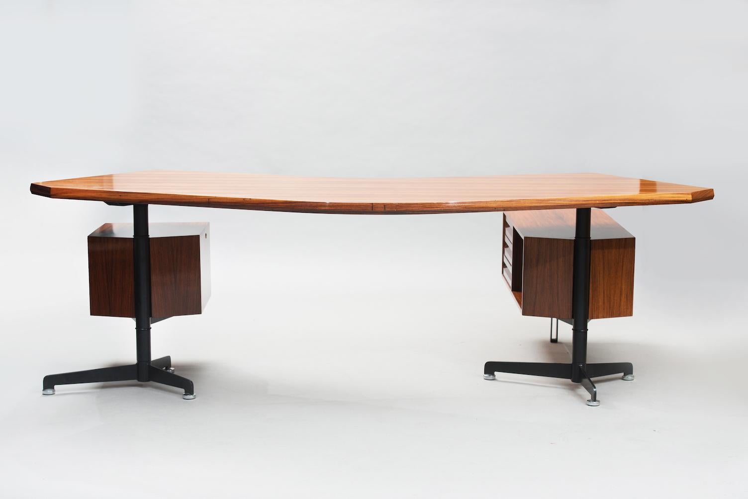 Boomerang executive desk model T96 designed by Osvaldo Borsani in 1956 for Tecno, Italy.
Rosewood and black enameled steel bases. The drawer units can rotate 360º to adopt different positions.