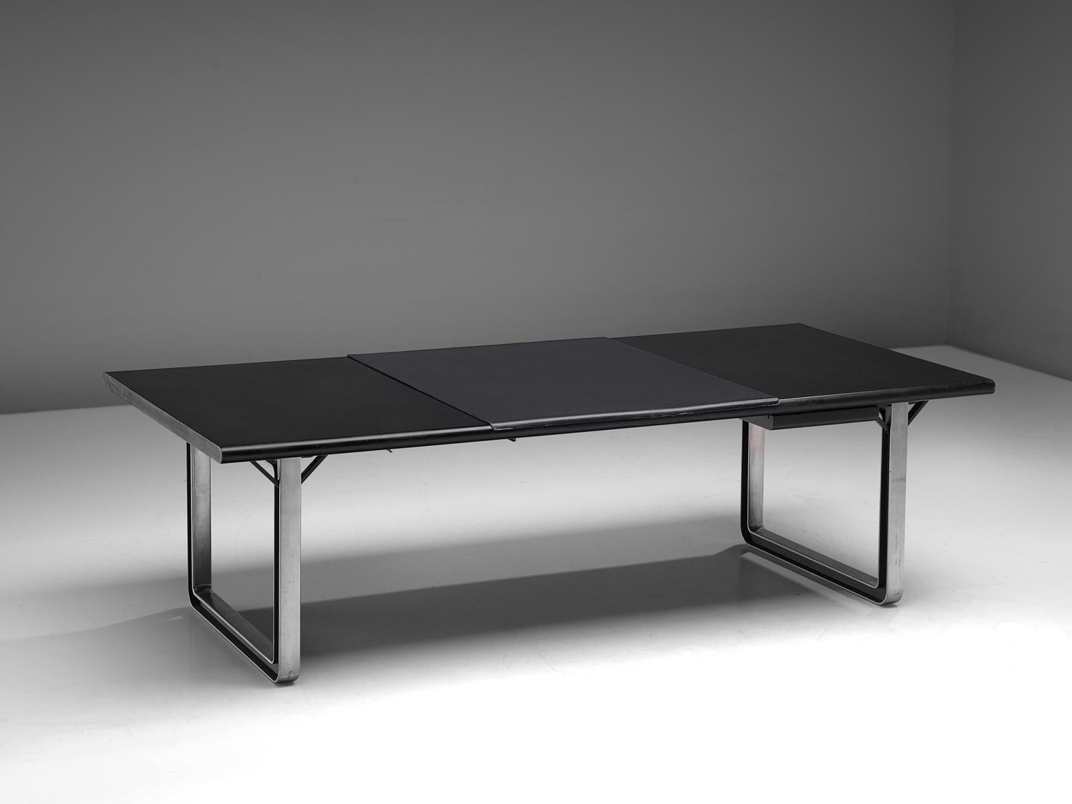Osvaldo Borsani for Tecno, desk/writing table, aluminum, lacquered wood and leather, Italy, 1970s.

Desk table with a black top. The base consists of a two metal frames. The base creates an open character with the dark top. It was at the time that