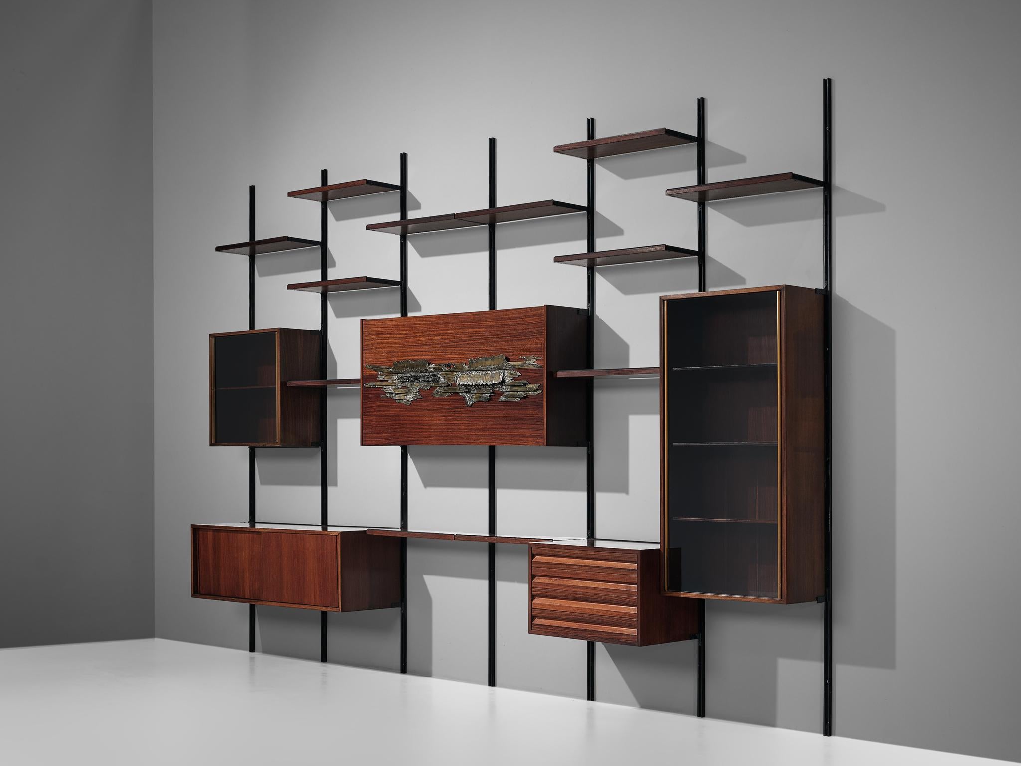 Osvaldo Borsani for Tecno, wall unit E22 with Arnaldo Pomorodo sculpture, wood, bronze, metal, glass, Italy, 1957

Breathtaking wall-mounted shelving unit by Osvaldo Borsani for Tecno. This piece catches the eye in an instant because of its