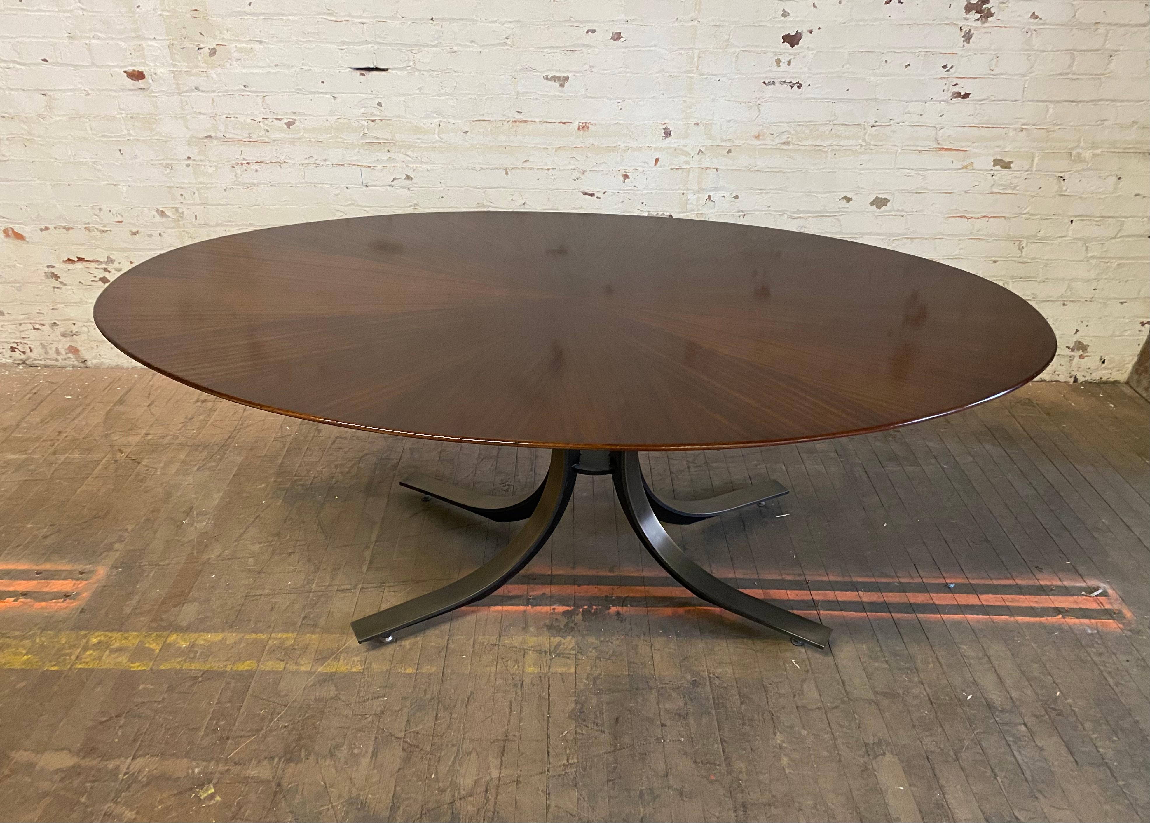 Osvaldo Borsani walnut & bronzed steel oval dining table, c. 1970,,, aMAZING starburst wood veneers,, Pictures do no justice,, Also retains wonderful bronzed tone steel base,, Hand delivery avail to New York City or anywhere en route from Buffalo NY.