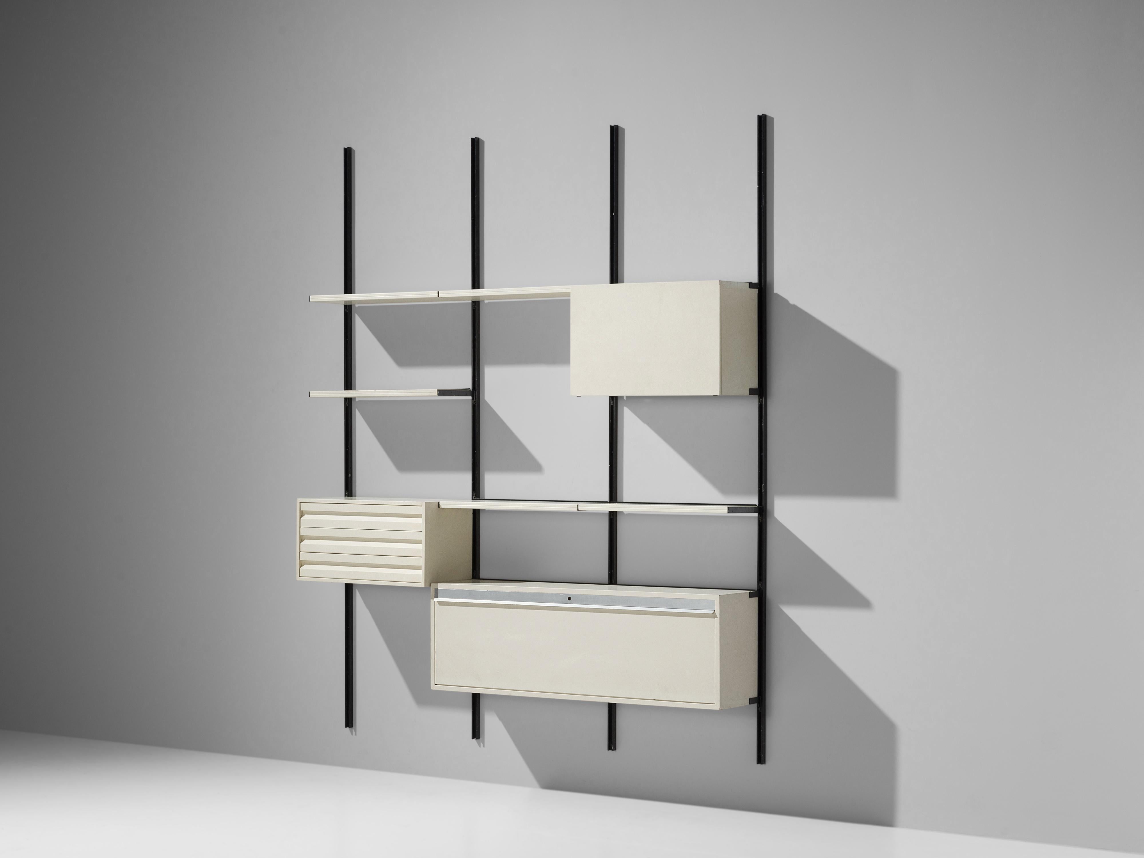 Osvaldo Borsani for Tecno, wall-mounted wall unit, metal, white laminated wood, Italy, 1950s 

This wall-mounted shelf is three compartments large. This shelving system was developed by Borsani as a coordinated system for furnishing either the home