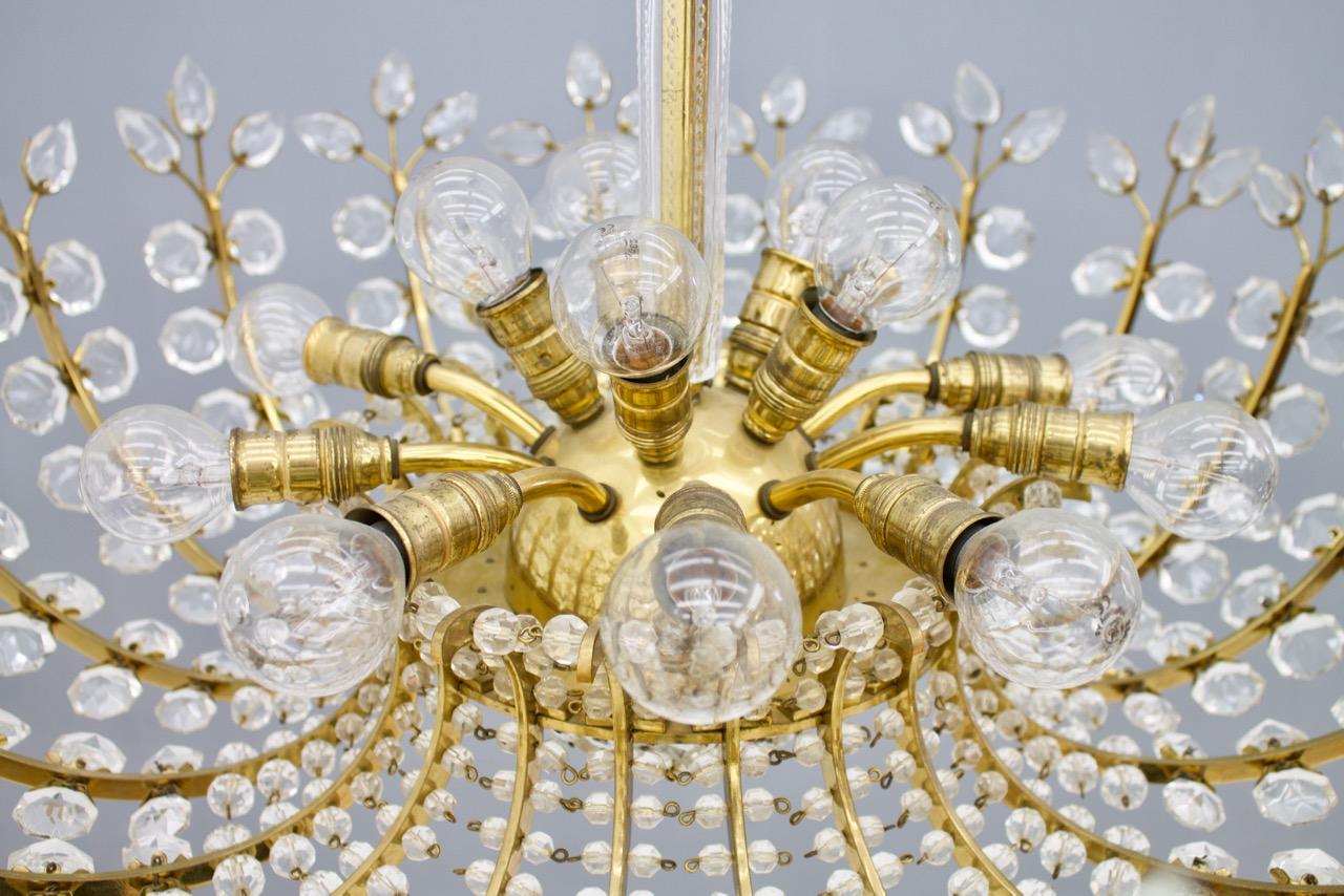 A rare chandelier by Oswald Haerdtl for Lobmeyr, Austria, 1955 in brass and crystal glass.
The lamp has 16 candelabra E14 sockets
Measures: Diameter 70 cm, height 45 cm.
Good until very good condition.

Oswald Haerdtl became known as one of the most