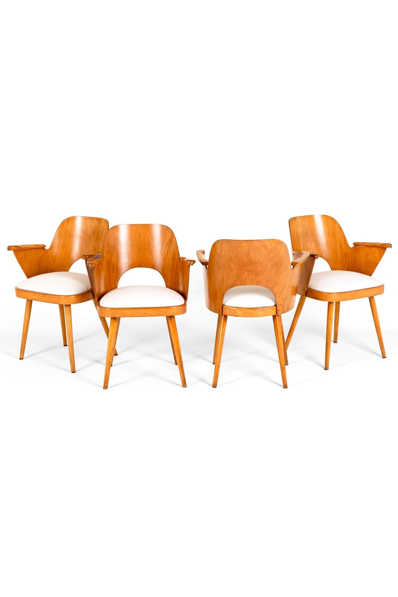 A set of four plywood dining chairs in original finish by renowned Czech designer Ozwald Haerdtl and manufacutred by Ligna.

This superb set in excellent condition are after a set designed by Haerdtl for Narodni Podnik Nlay that date to 1955.

The