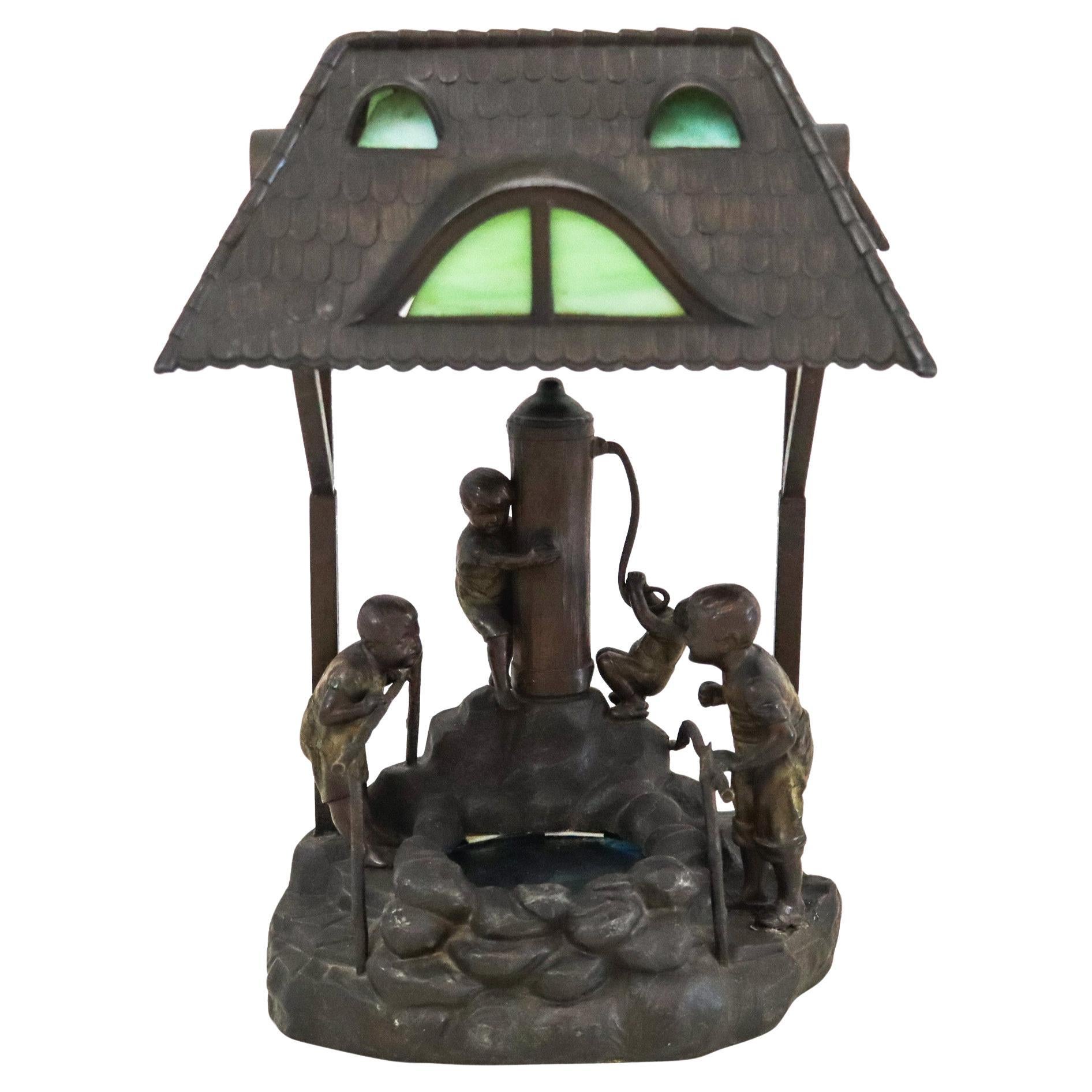 Lampe de bureau osWALD SCHIMMELPFENNIG 1890 avec des enfants dans une pompe à eau en vente