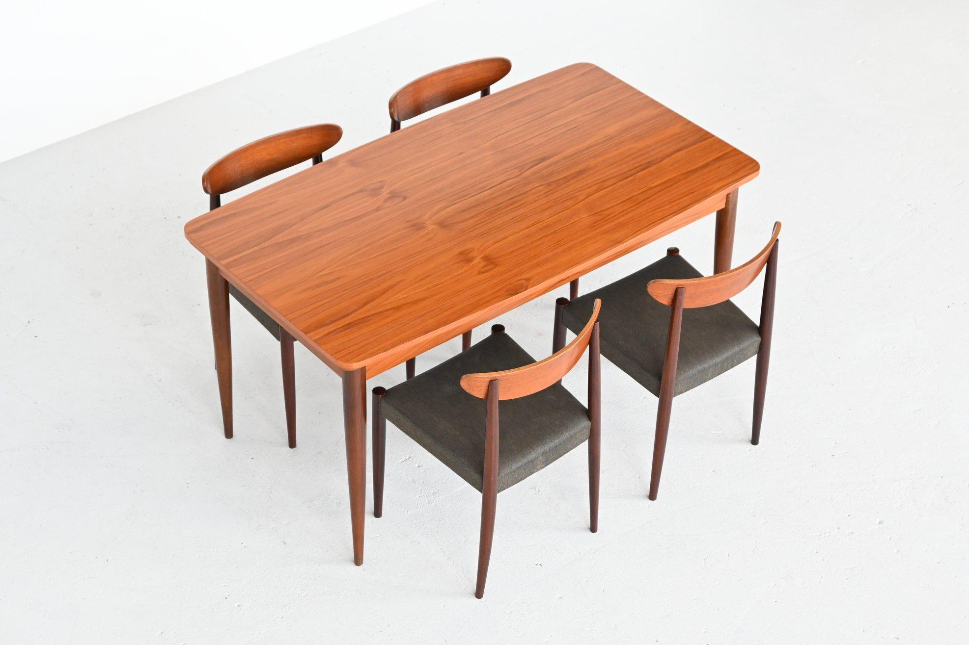 Very nice dining table designed by Oswald Vermaercke and manufactured by V Form, Belgium 1960. This table has solid teak wooden legs and a veneered top. It has a beautiful warm grain to the wood. The table can be easily extended from 150 cm to 270
