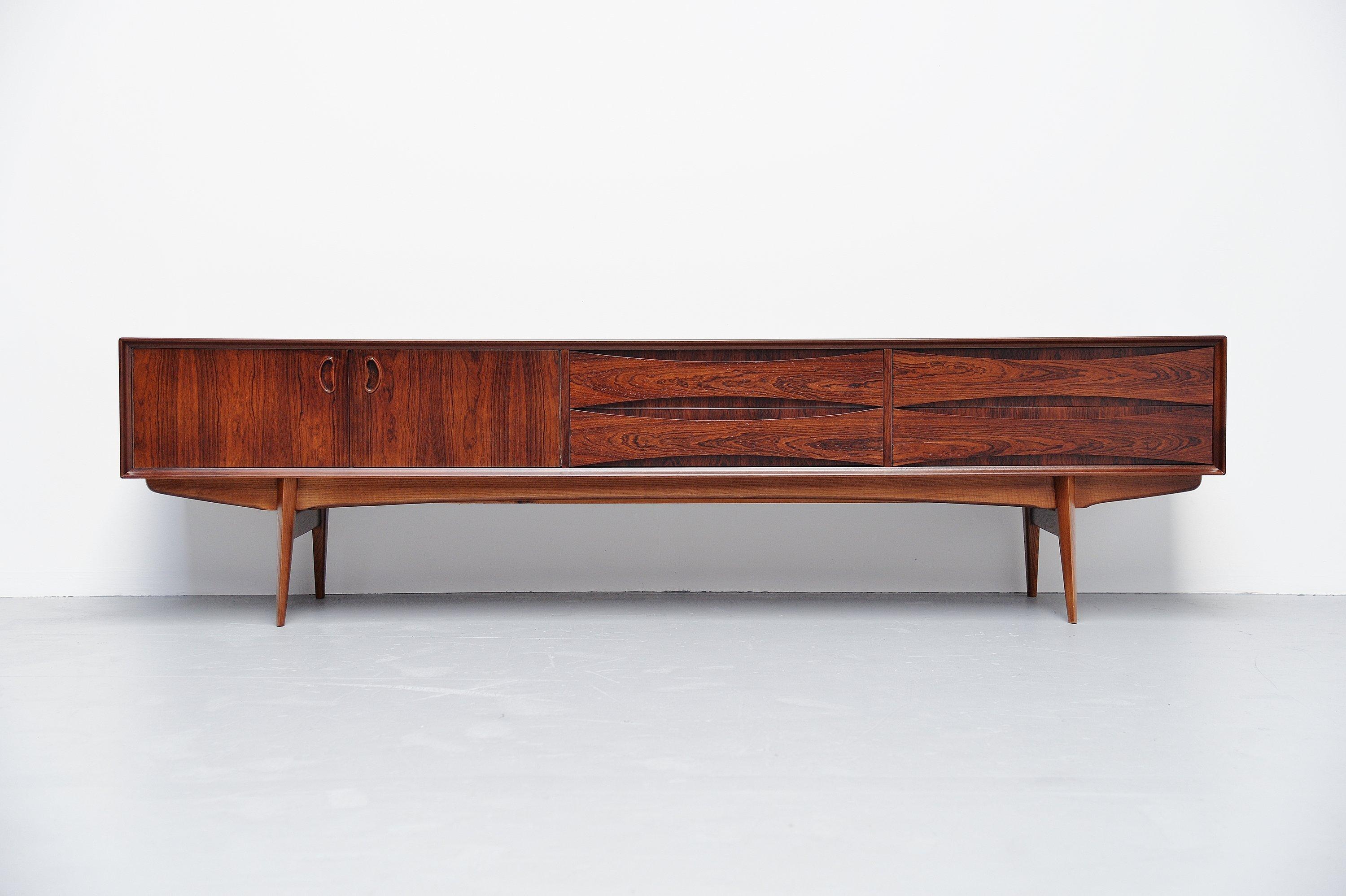 Super quality low sideboard designed by Oswald Vermaercke and manufactured by V-Form, Belgium, 1959. This amazing low credenza has a very nice and warm rosewood color with beautiful deep grain and is fully refinished into perfect condition. The